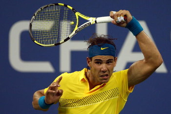 NEW YORK - SEPTEMBER 08: Rafael Nadal of Spain returns a shot to Gael Monfils of France during day nine of the 2009 U.S. Open at the USTA Billie Jean King National Tennis Center on September 8, 2009 in the Flushing neighborhood of the Queens borough of