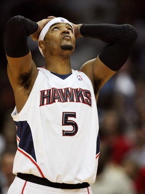 ATLANTA - MAY 03:  Josh Smith #5 of the Atlanta Hawks takes a moment and looks up with less than a minute to play against the Miami Heat during Game Seven of the Eastern Conference Quarterfinals at Philips Arena on May 3, 2009 in Atlanta, Georgia. The Haw