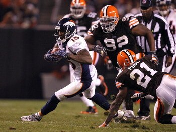 CLEVELAND - NOVEMBER 06:  Brandon Marshall #15 of the Denver Broncos runs by Brodney Pool #21 and Shaun Rogers #92 of the Cleveland Browns during the second quarter of their NFL game at Cleveland Browns Stadium November 6, 2008 in Cleveland, Ohio.  (Photo