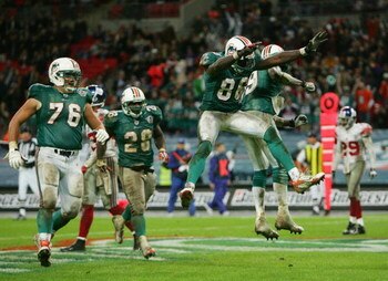 LONDON - OCTOBER 28:  Ted Ginn Jr. #19 (R) of the Dolphins celebrates with teammate Marty Booker #86 after making a touchdown reception during the NFL Bridgestone International Series match between New York Giants and  Miami Dolphins at Wembley Stadium on