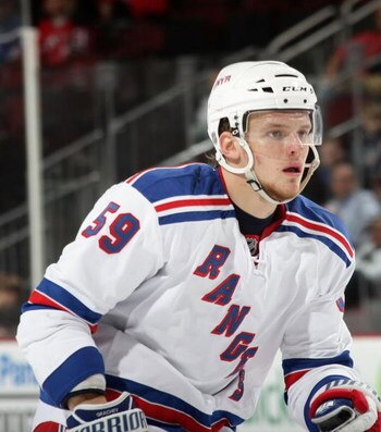 NEWARK, NJ - SEPTEMBER 16: Evgeny Grachev #59 of the New York Rangers skates against the New Jersey Devils at the Prudential Center on September 16, 2009 in Newark, New Jersey. The Devils defeated the Rangers 3-2 in the shoot out. (Photo by Bruce Bennett/