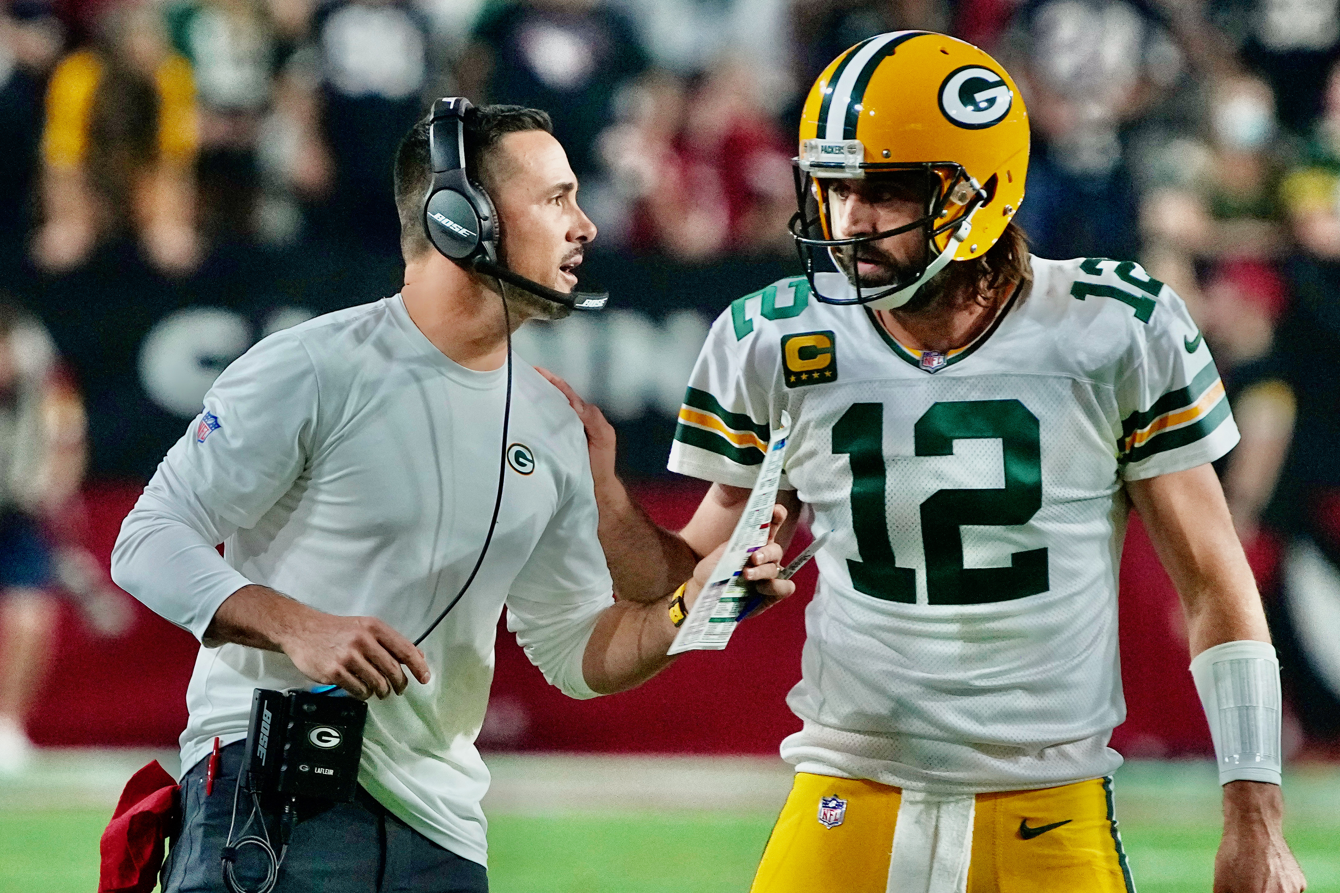 Arizona Cardinals' Jonathan Ward collides with Green Bay Packers