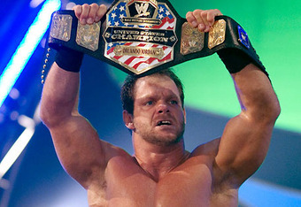 Chris Benoit holds up the WWE United States championship.