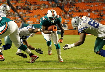 Miami Dolphins outside linebacker Jason Trusnik (93) watches the