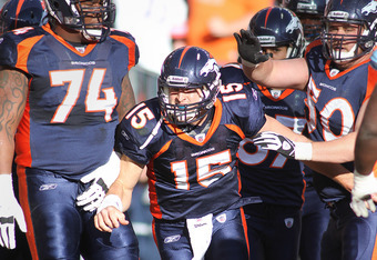 Quarterback Tim Tebow (15) celebrates a score during an NFL game against  the New England Patriots – Denver Broncos History