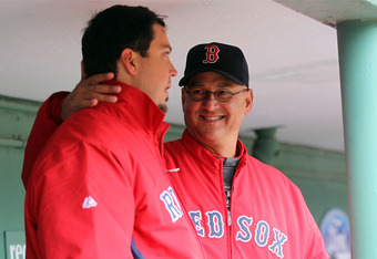 Boston Red Sox manager Terry Francona chats with pitcher Josh Beckett  during batting practice before game four of the ALCS against the Tampa Bay  Rays at Fenway Park in Boston, Massachusetts on