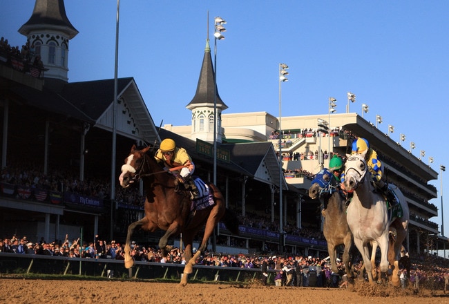 LOUISVILLE, KY - NOVEMBER 05: Jockey Ramon Dominguez rides Hansen #5, far right, ahead of jockey Javier Castellano and Union Rags #10 to win the Breeders' Cup Juvenile during the 2011 Breeders' Cup World Championships at Churchill Downs on November 5, 2011 in Louisville, Kentucky. (Photo by Rob Carr/Getty Images)