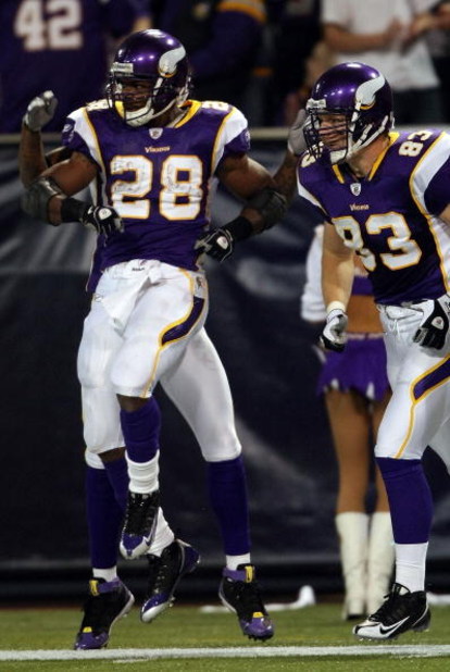 MINNEAPOLIS - JANUARY 4:  Adrian Peterson #28 of the Minnesota Vikings celebrates his touchdown with teammate Jeff Dugan #83 in the first half against the Philadelphia Eagles during the NFC Wild Card playoff game on January 4, 2009 at the Hubert H. Humphr