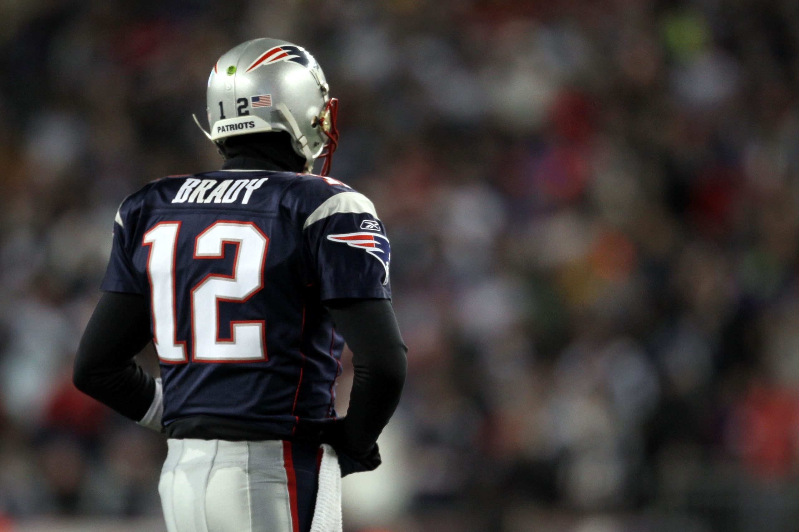 FOXBORO, MA - JANUARY 16:  Tom Brady #12 of the New England Patriots looks on during their 2011 AFC divisional playoff game against the New York Jets at Gillette Stadium on January 16, 2011 in Foxboro, Massachusetts.  (Photo by Jim Rogash/Getty Images)