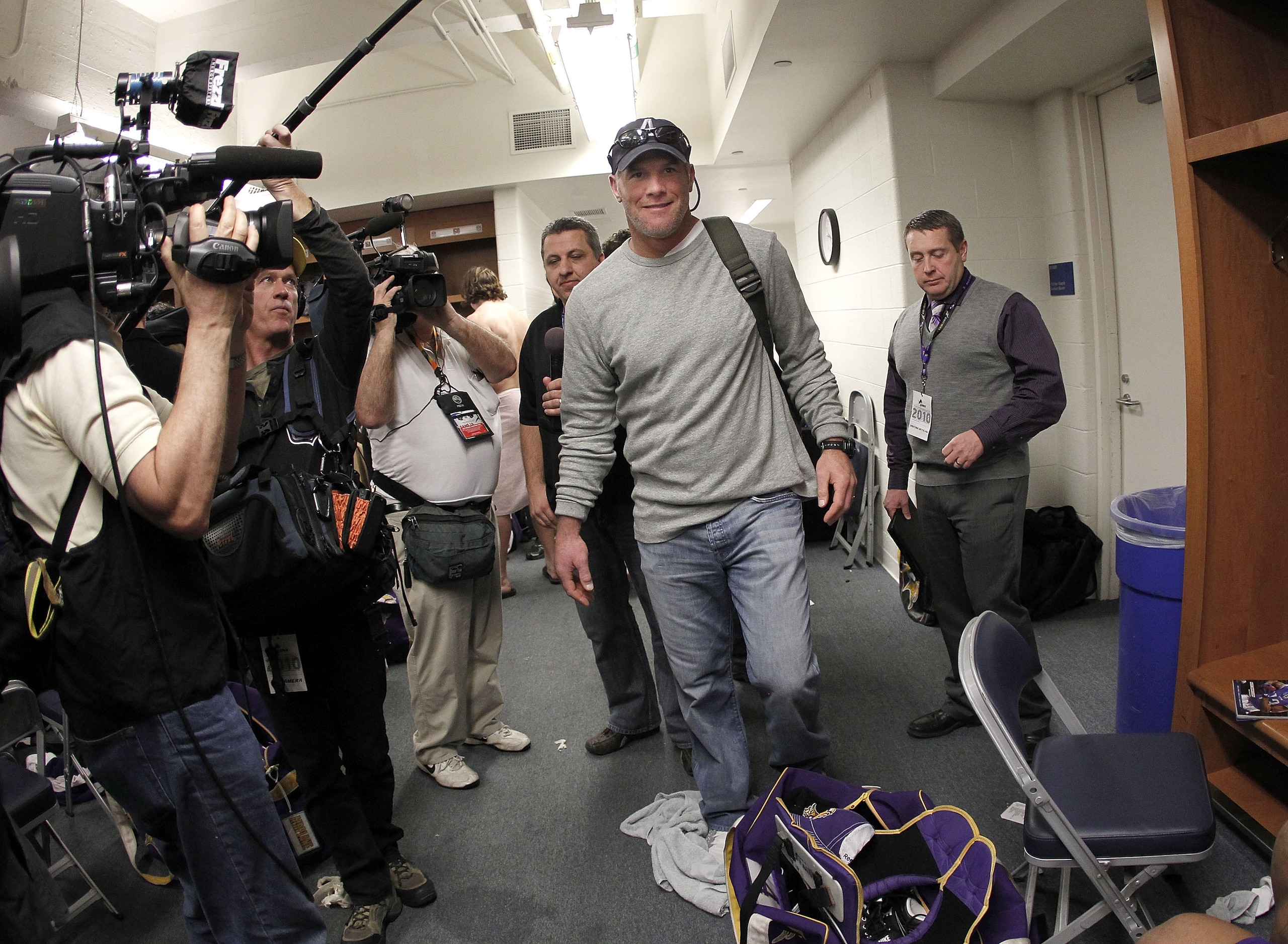 DETROIT, MI - JANUARY 02:  Brett Favre #4 of the Minnesota Vikings heads to a post game press conference after a 13-20 loss to the Detroit Lions at Ford Field on January 2, 2011 in Detroit, Michigan.  (Photo by Gregory Shamus/Getty Images)