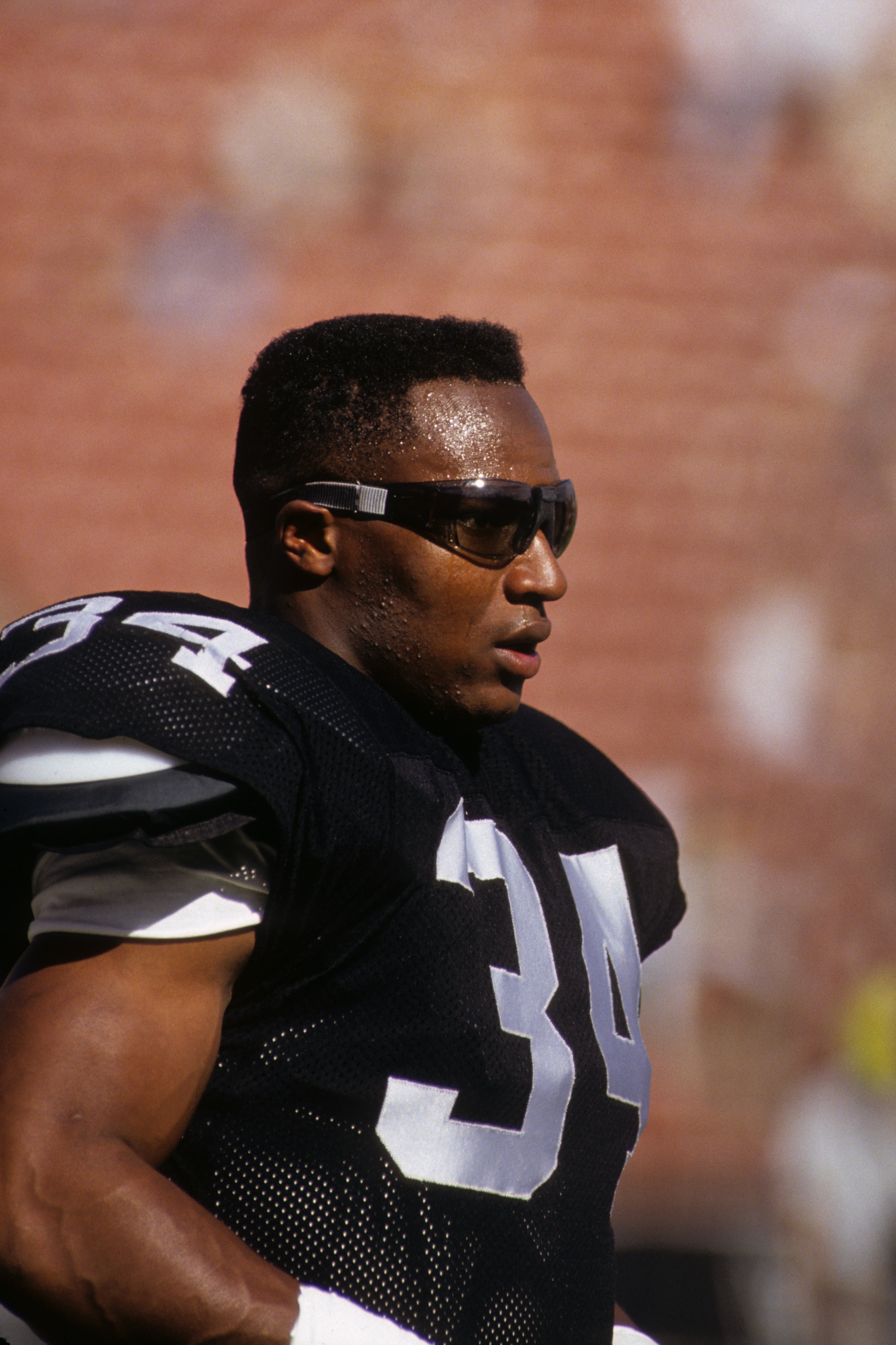 LOS ANGELES - NOVEMBER 11:  Running back Bo Jackson #34 of the Los Angeles Raiders looks on during a game against the Green Bay Packers at the Los Angeles Memorial Coliseum on November 11, 1990 in Los Angeles, California.  The Packers won 29-16.  (Photo b