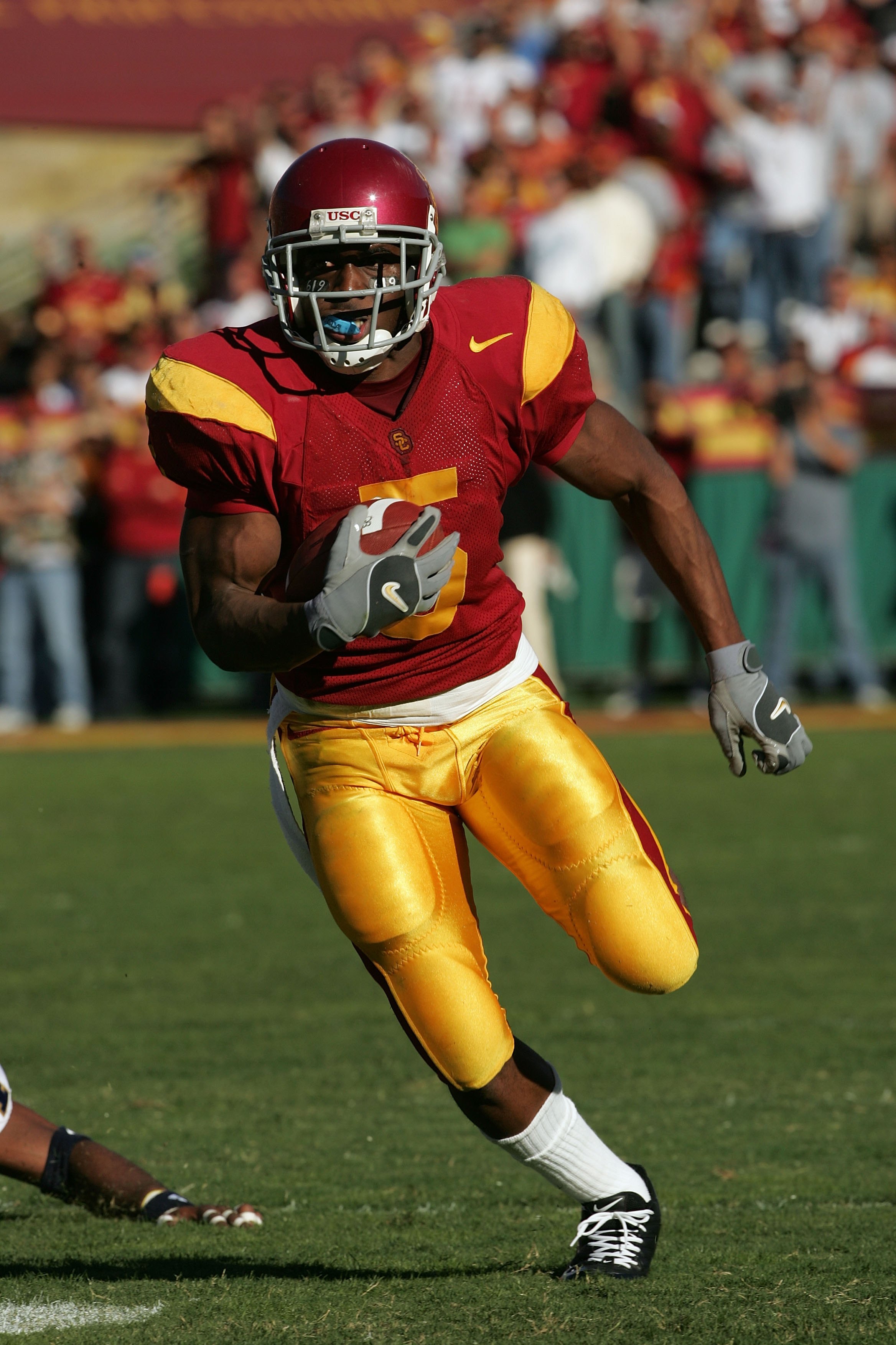 LOS ANGELES, CA - DECEMBER 03: (FILE PHOTO) Reggie Bush #5 of the USC Trojans rushes the ball against the UCLA Bruins December 3, 2005 at the Los Angeles Memorial Coliseum in Los Angeles, California. Bush was picked second overall by the New Orleans Saint