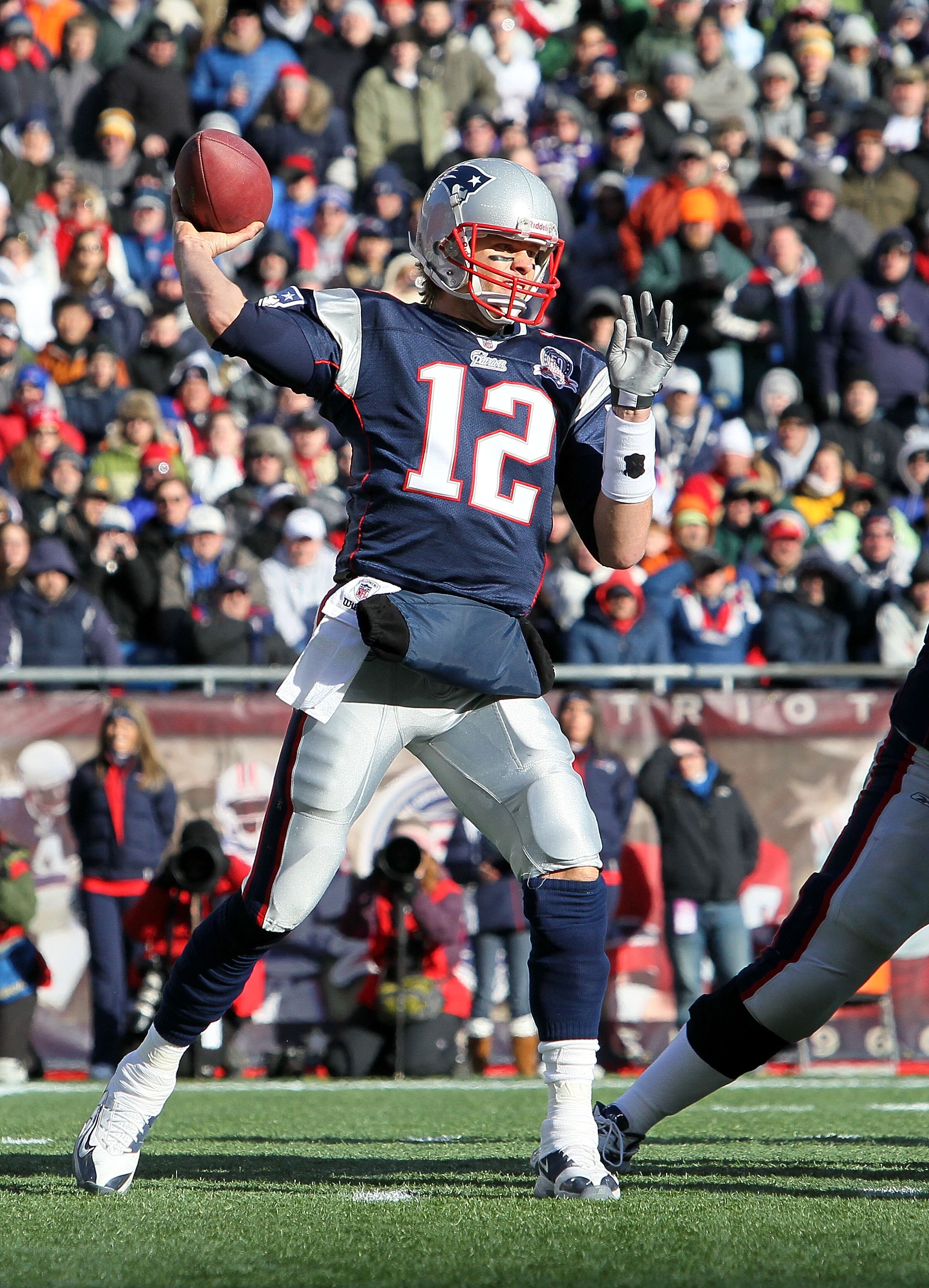 FOXBORO, MA - JANUARY 10:  Tom Brady #12 of the New England Patriots throws a pass against the Baltimore Ravens during the 2010 AFC wild-card playoff game at Gillette Stadium on January 10, 2010 in Foxboro, Massachusetts. The Ravens won 33-14. (Photo by J