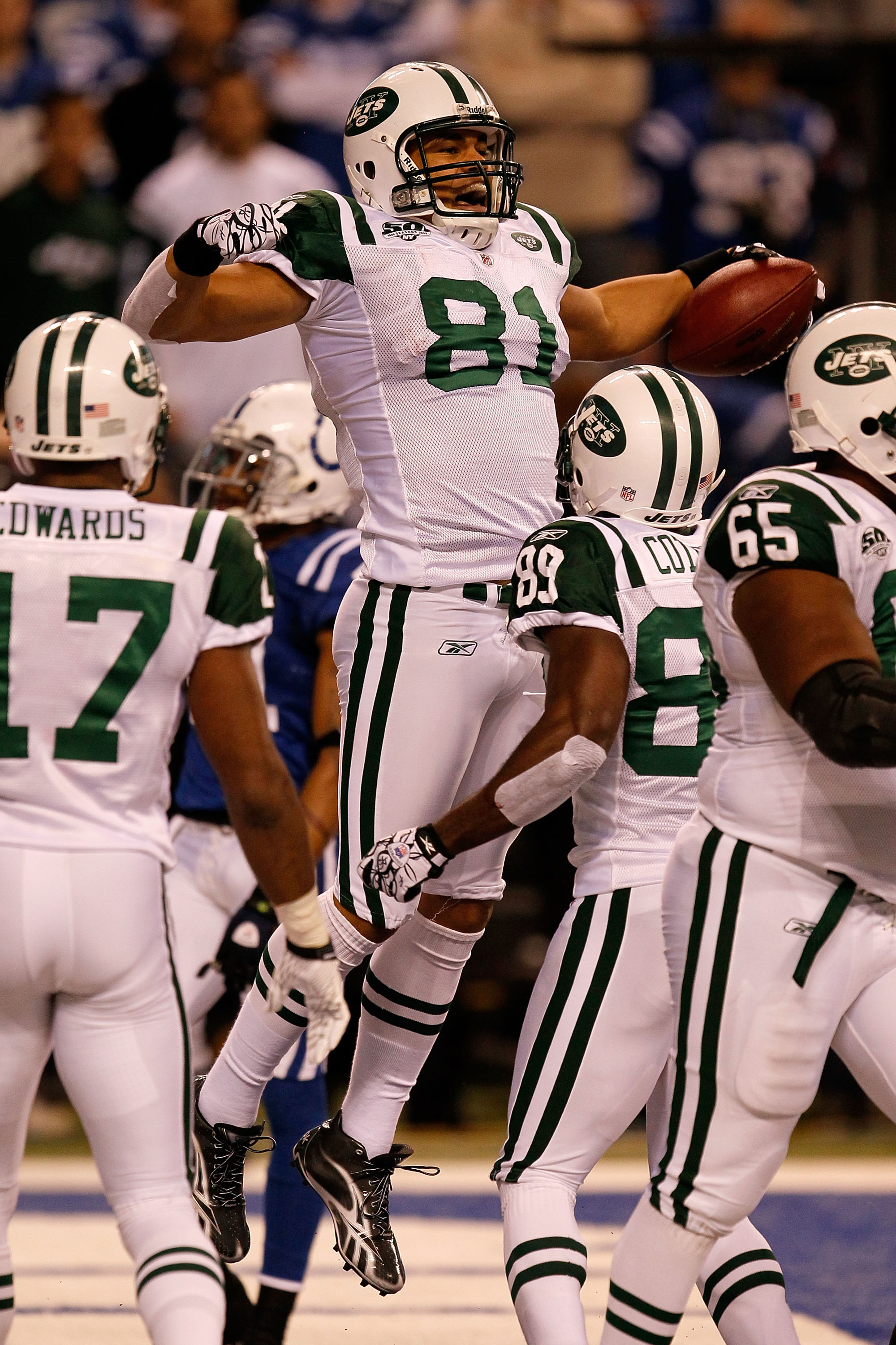INDIANAPOLIS - JANUARY 24:  Dustin Keller #81 of the New York Jets celebrates his touchdown in the second quarter with teammates Jerricho Cotchery #89 and Braylon Edwards #17 while playing against the Indianapolis Colts during the AFC Championship Game at