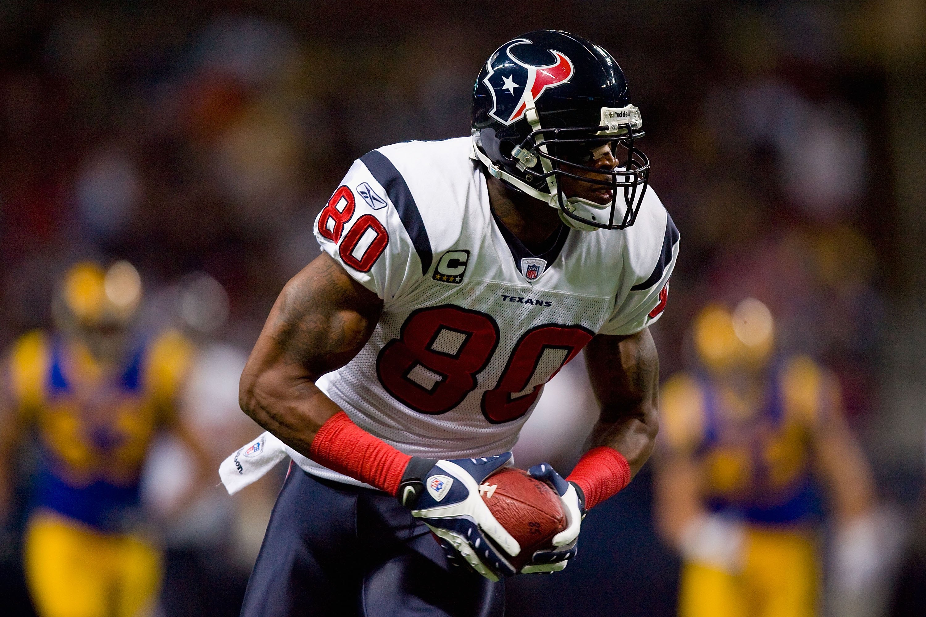 ST. LOUIS - DECEMBER 20:  Andre Johnson #80 of the Houston Texans carries the ball during the game against the St. Louis Rams at Edward Jones Dome on December 20, 2009 in St. Louis, Missouri.  (Photo by Dilip Vishwanat/Getty Images)