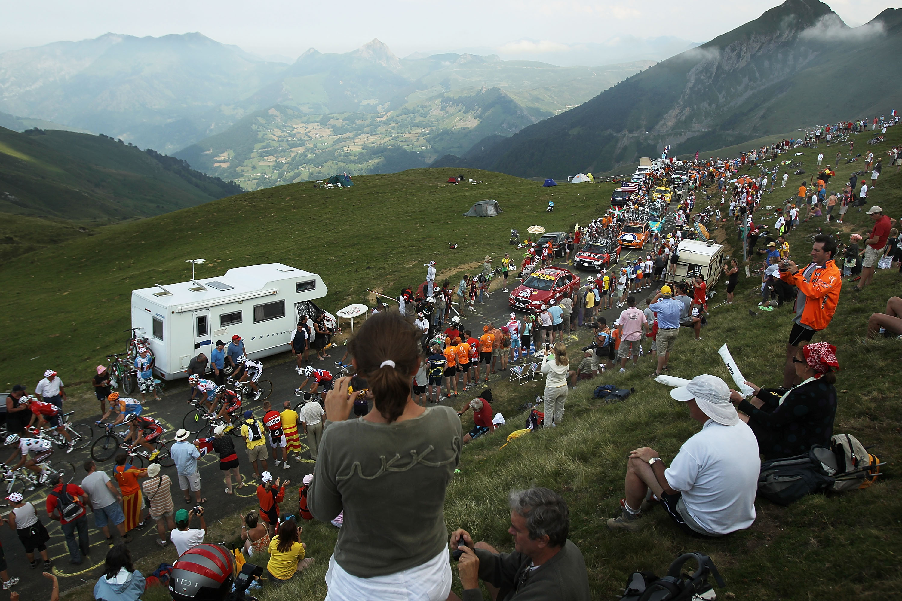 PAU, FRANCE - JULY 20: Thousands cheer on the peloton as they come to the top of the Col du Tourmalet during stage 16 of the Tour de France on July 20, 2010 in Pau, France. The stage, between Bagneres-de-Luchon and Pau, featured four major climbs includin