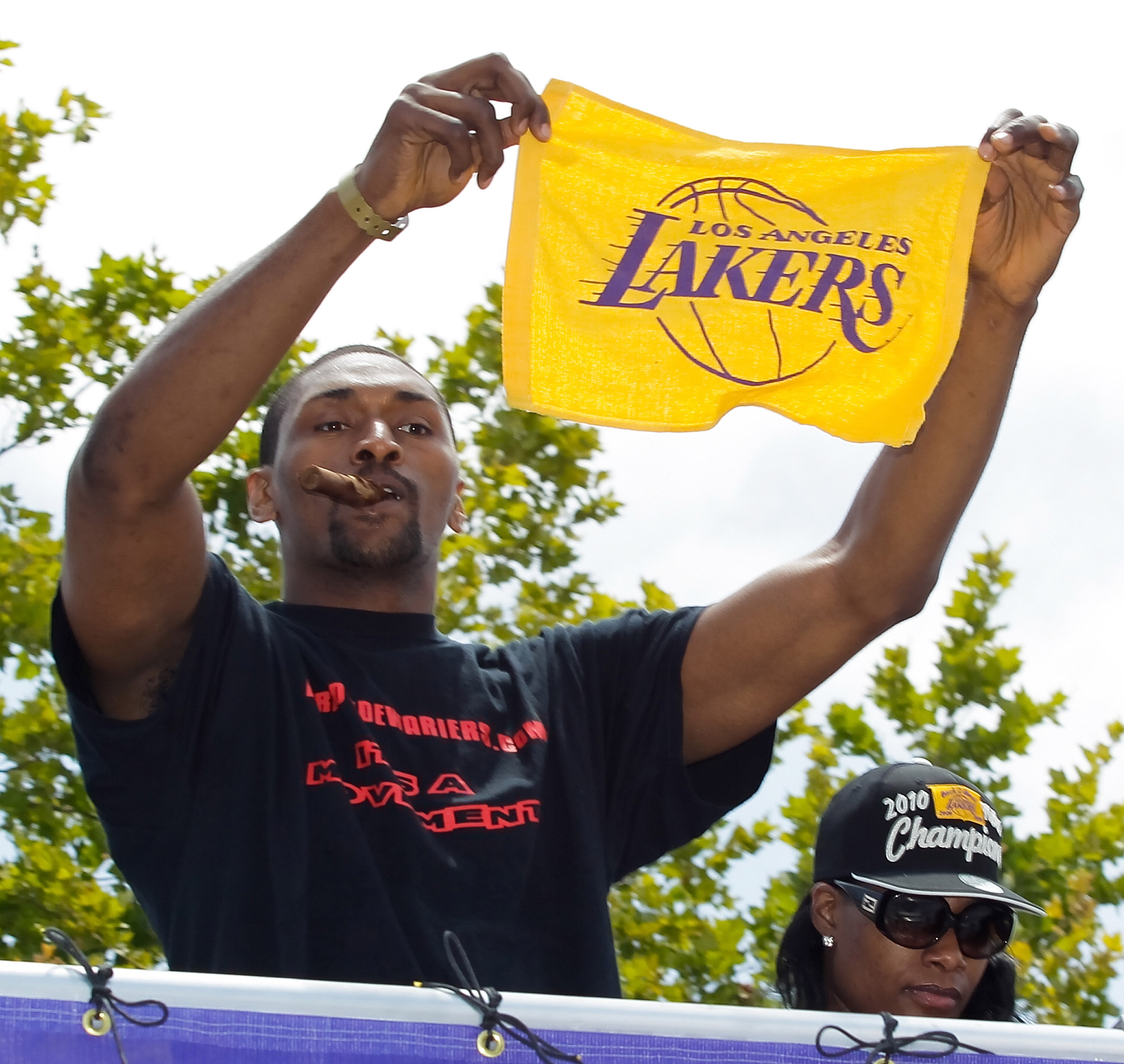 LOS ANGELES, CA - JUNE 21:  Los Angeles Lakers small forward Ron Artest salutes the crowd while riding in the victory parade for the the NBA basketball champion team on June 21, 2010 in Los Angeles, California. The Lakers beat the Boston Celtics 87-79 in