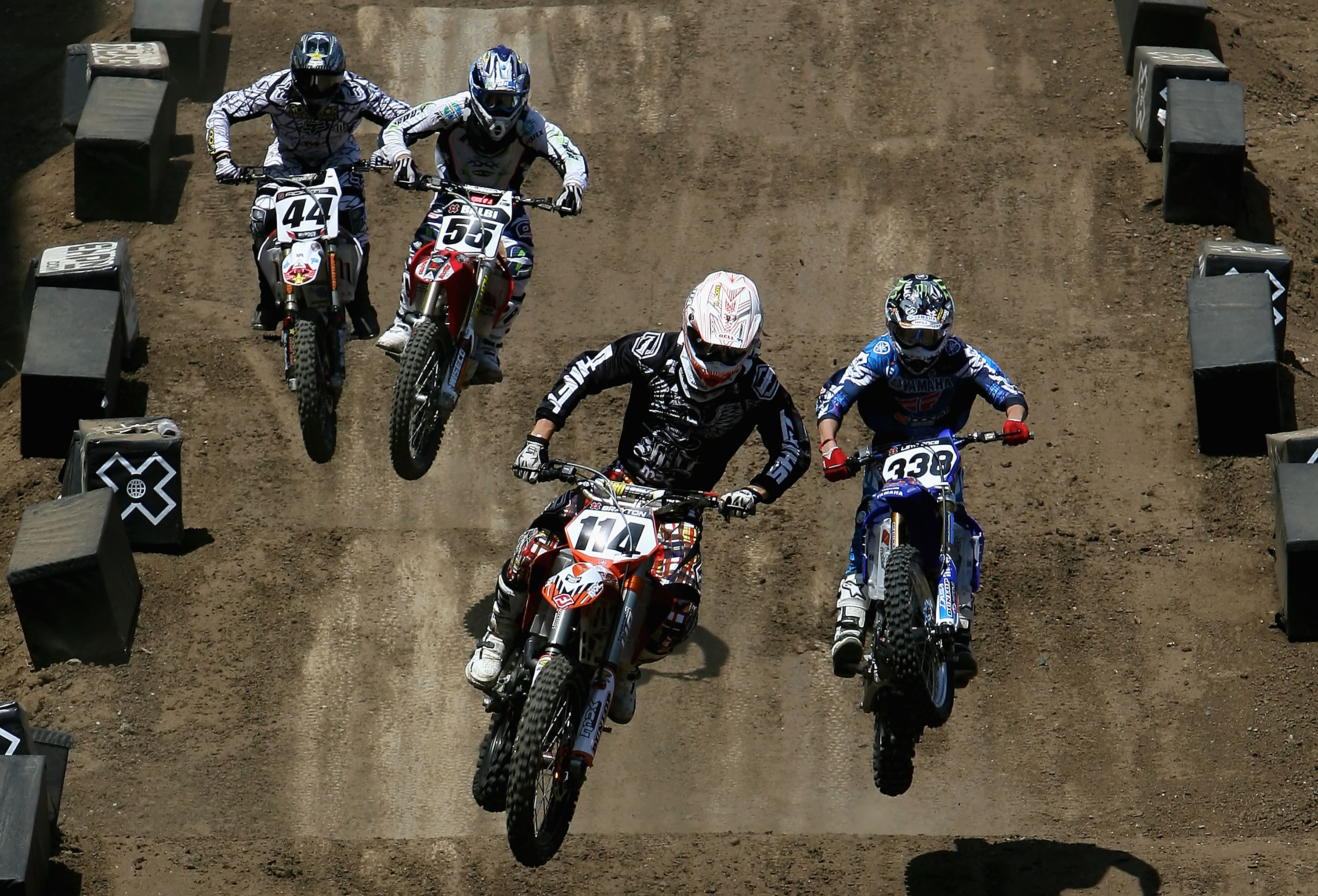 CARSON, CA - AUGUST 02: (L-R) Troy Adams, Antonio Balbi of Brazil, Justin Brayton and Jason Lawrence compete in the men's Moto X Racing final during the summer X Games 14 at Home Depot Center on August 2, 2008 in Carson, California. (Photo by Christian