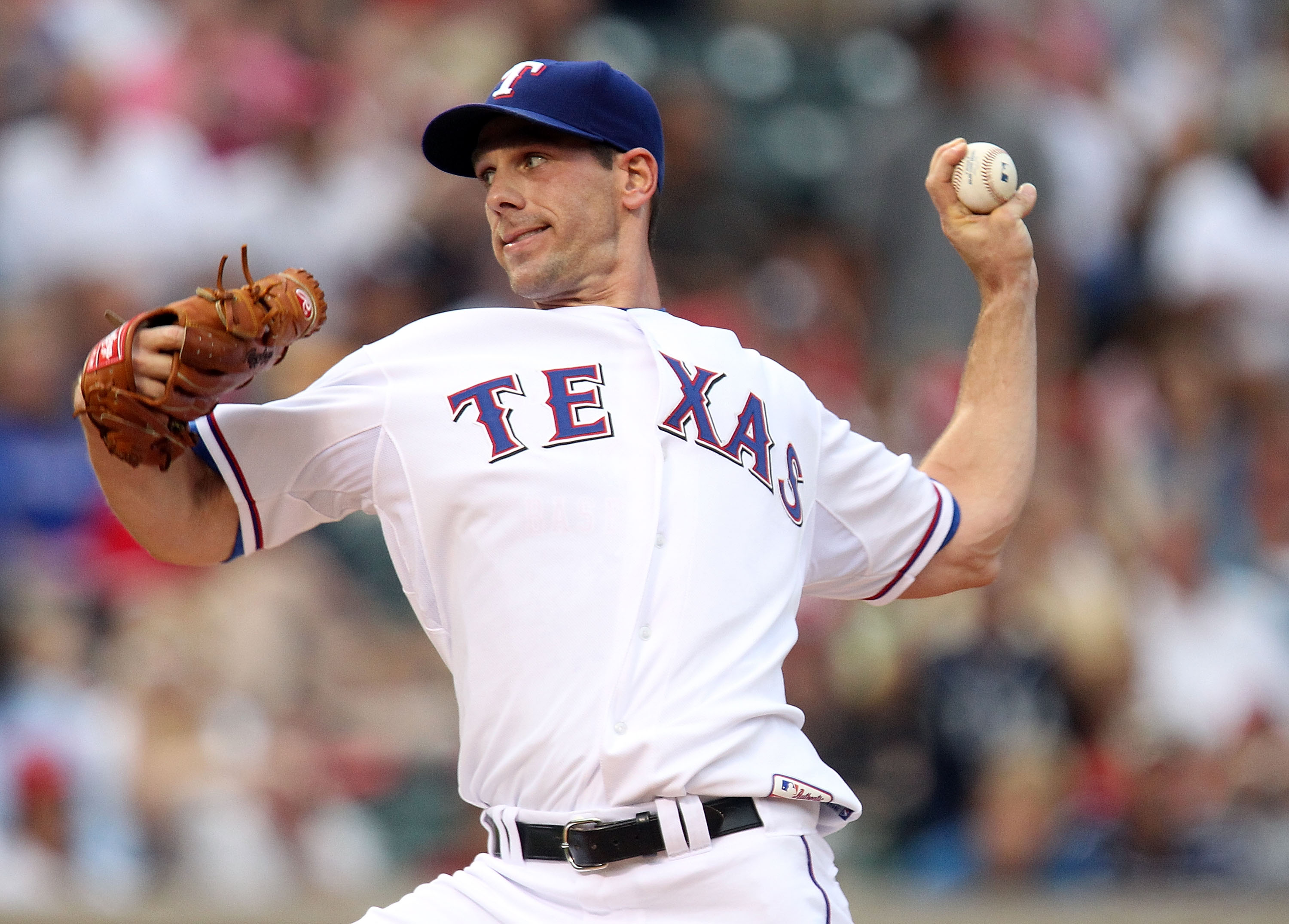 ARLINGTON, TX - JULY 10:  Pitcher Cliff Lee #33 of the Texas Rangers throws against the Baltimore Orioles on July 10, 2010 at Rangers Ballpark in Arlington, Texas.  (Photo by Ronald Martinez/Getty Images)