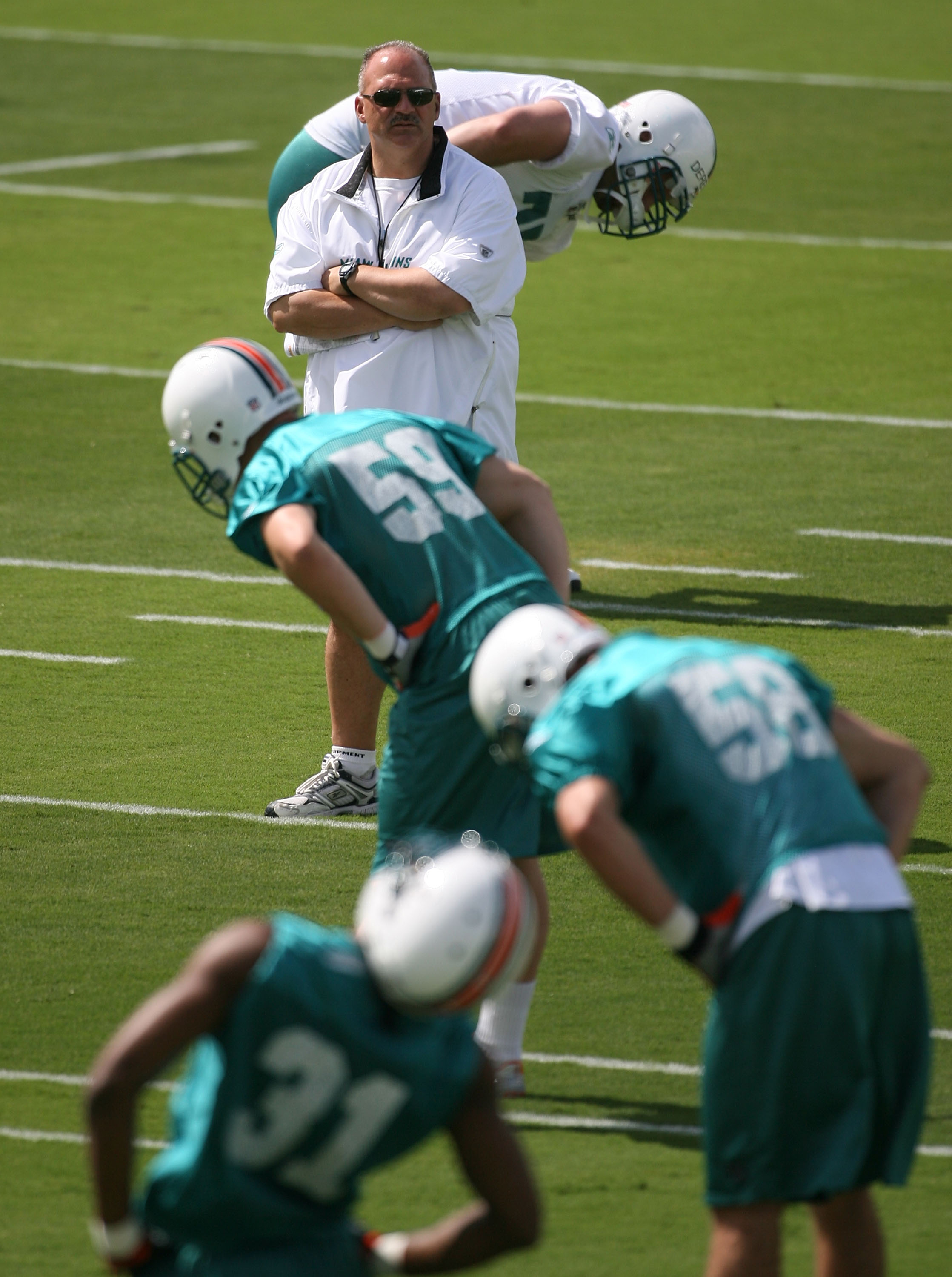 Miami Dolphins backup quarterback Mike White bangs a drum before