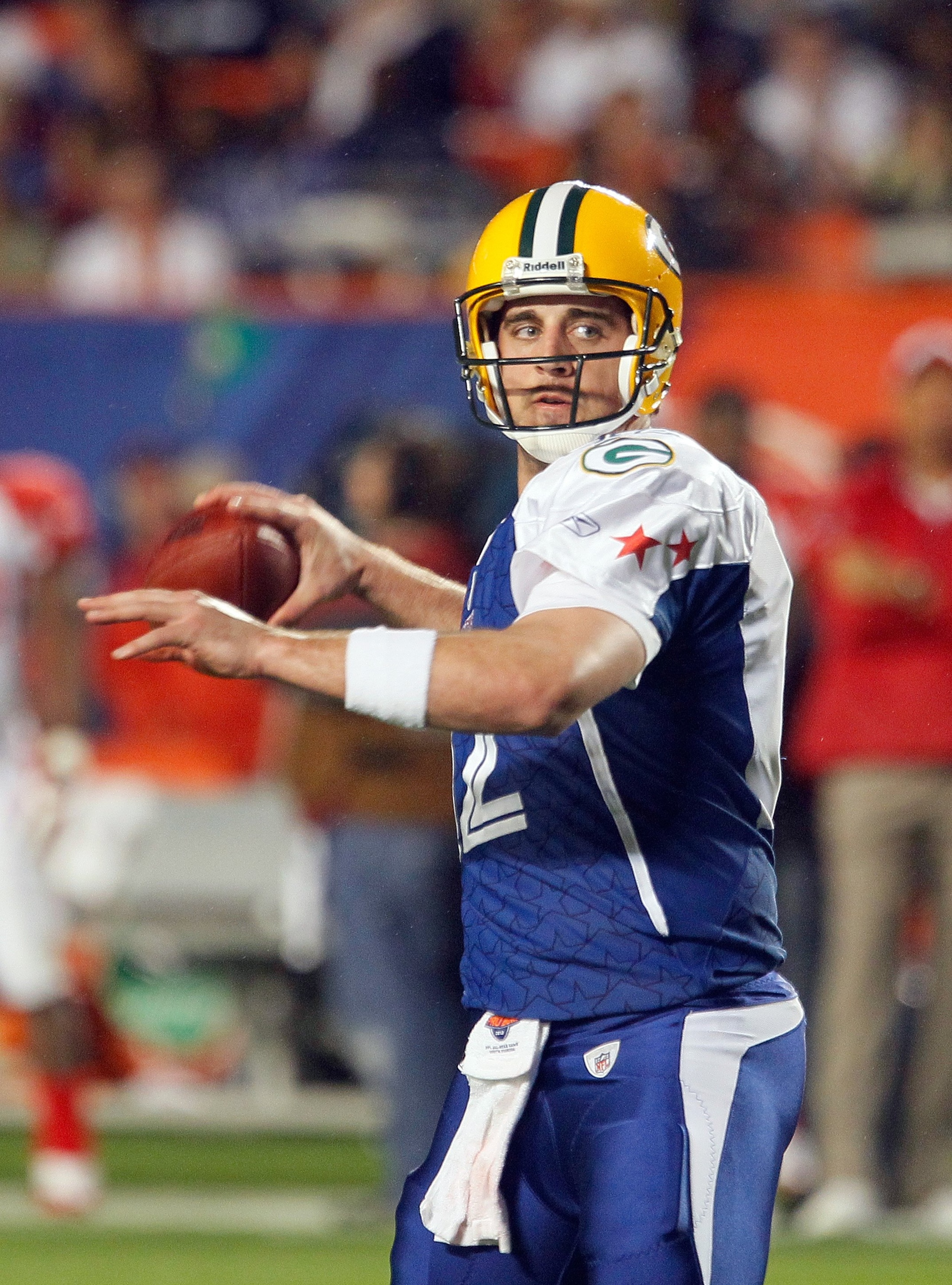 MIAMI GARDENS, FL - JANUARY 31:  Aaron Rodgers #12 of the NFC's Green Bay Packers makes a pass play during the 2010 AFC-NFC Pro Bowl game at Sun Life Stadium on January 31, 2010 in Miami Gardens, Florida. The AFC defeated the NFC 41-34. (Photo by Scott Ha