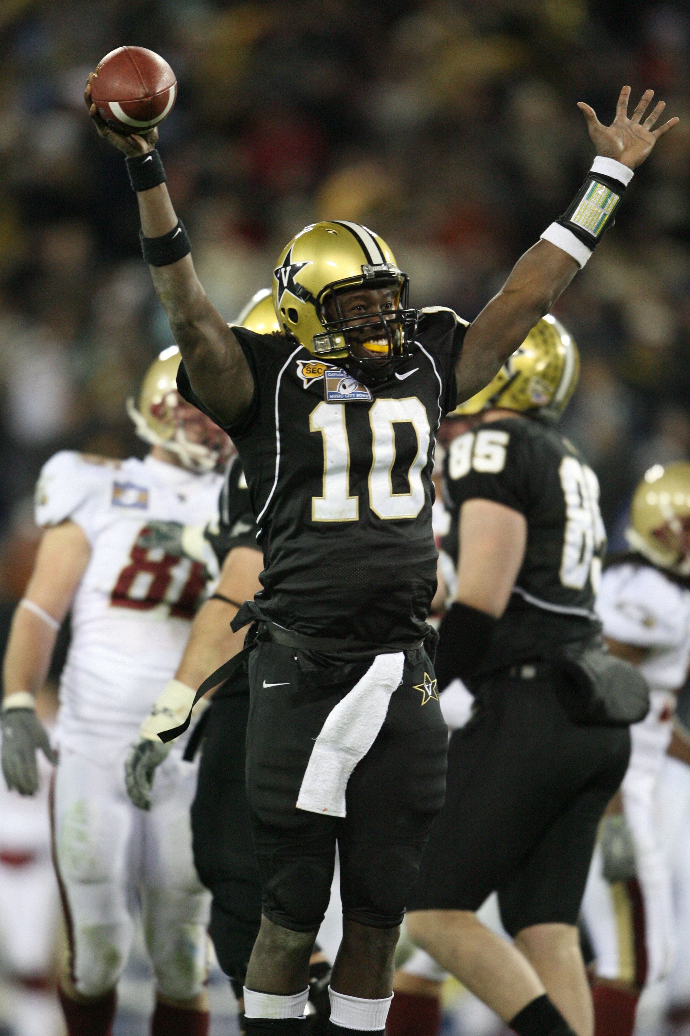 NASHVILLE, TN - DECEMBER 31:  Larry Smith #10 of the Vanderbilt Commodores celebrates against the Boston College Eagles during the Gaylord Hotels Music City Bowl at LP Field on December 31, 2008 in Nashville, Tennessee.  (Photo by Andy Lyons/Getty Images)