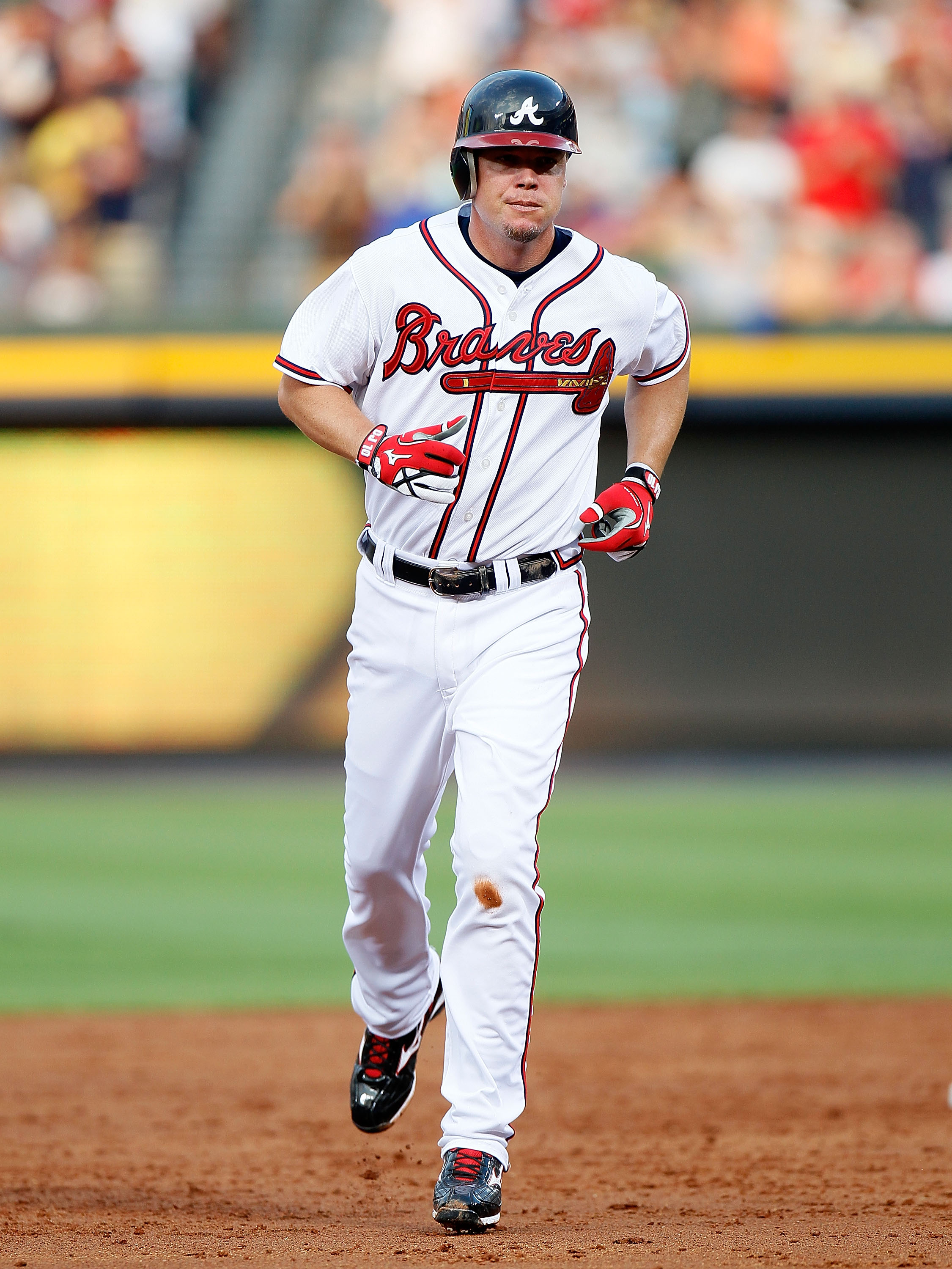 ATLANTA - JULY 15:  Chipper Jones #10 of the Atlanta Braves trotts to third base after hitting a solo homer in the third inning against the Milwaukee Brewers at Turner Field on July 15, 2010 in Atlanta, Georgia.  (Photo by Kevin C. Cox/Getty Images)