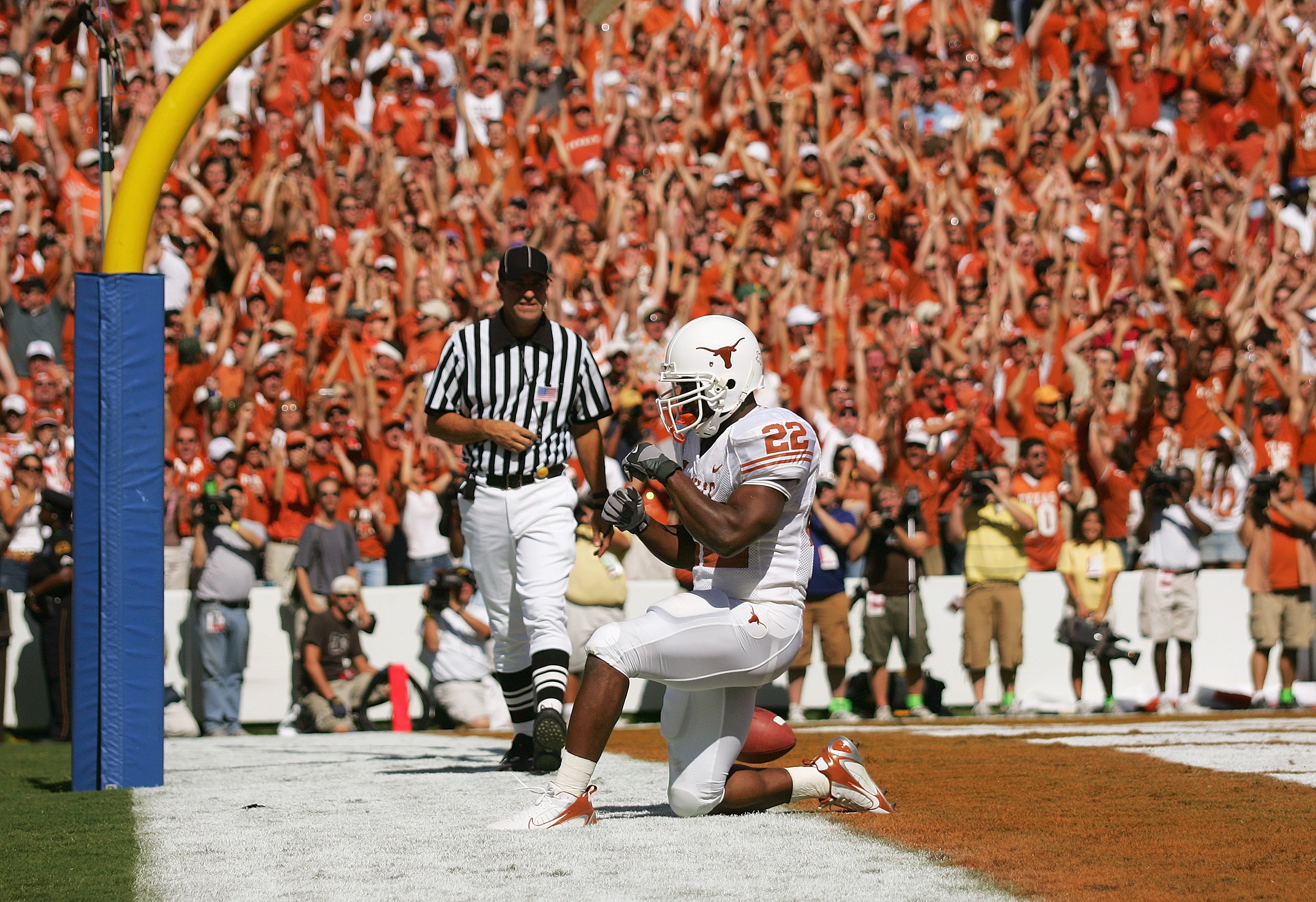 DALLAS - OCTOBER 7:  Running back Selvin Young #22 of the Texas Longhorns kneels in the endzone after scoring a touchdown against the Oklahoma Sooners during the Red River Shootout at the Cotton Bowl on October 7, 2006 in Dallas, Texas. The Longhorns won 