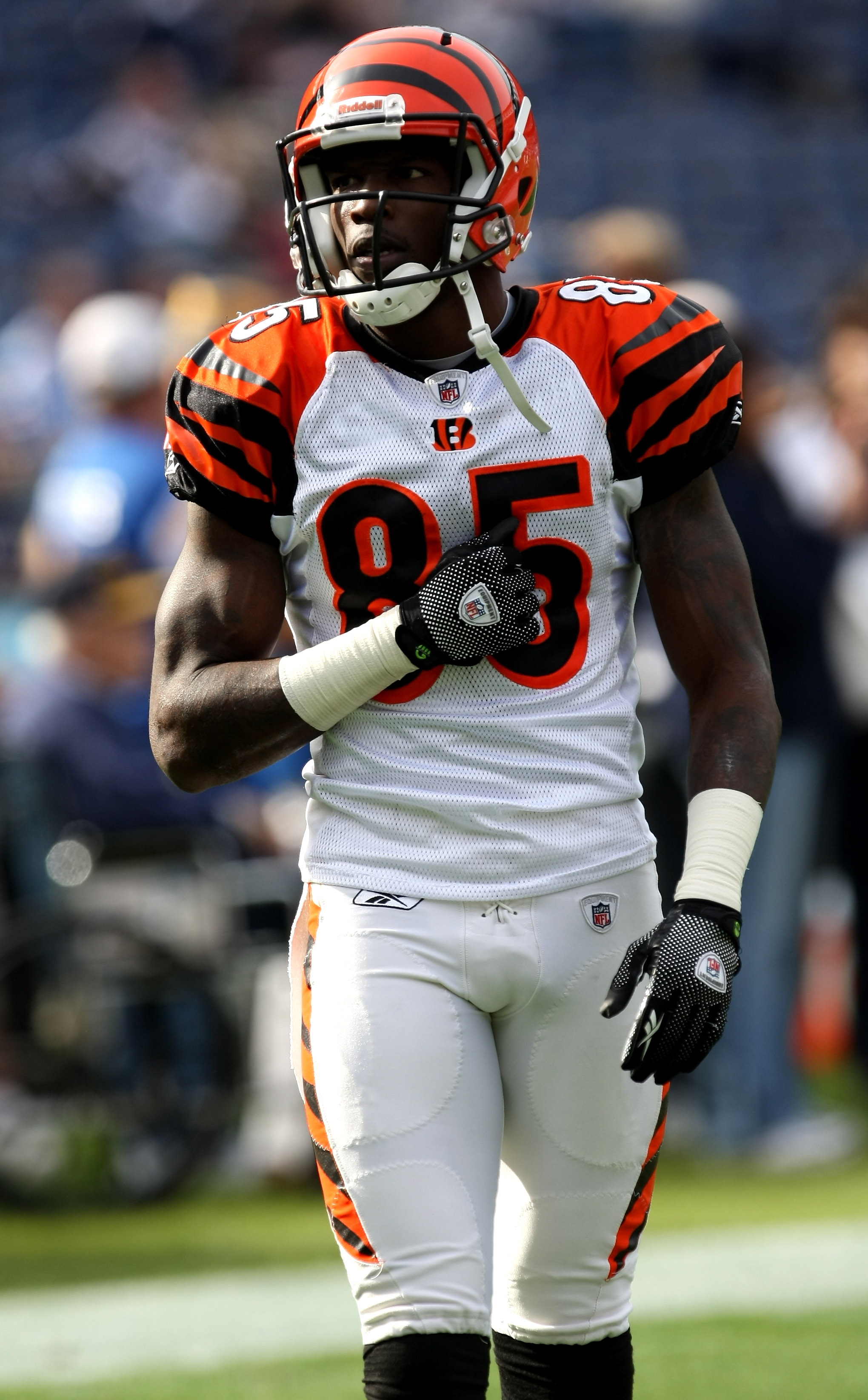 SAN DIEGO - DECEMBER 20:  Chad Ochocinco #85 of the Cincinnati Bengals salutes Charger fans holding a sign honoring his deceased teammate Chris Henry during warmups for the game with the San Diego Chargers on December 20, 2009 at Qualcomm Stadium in San D