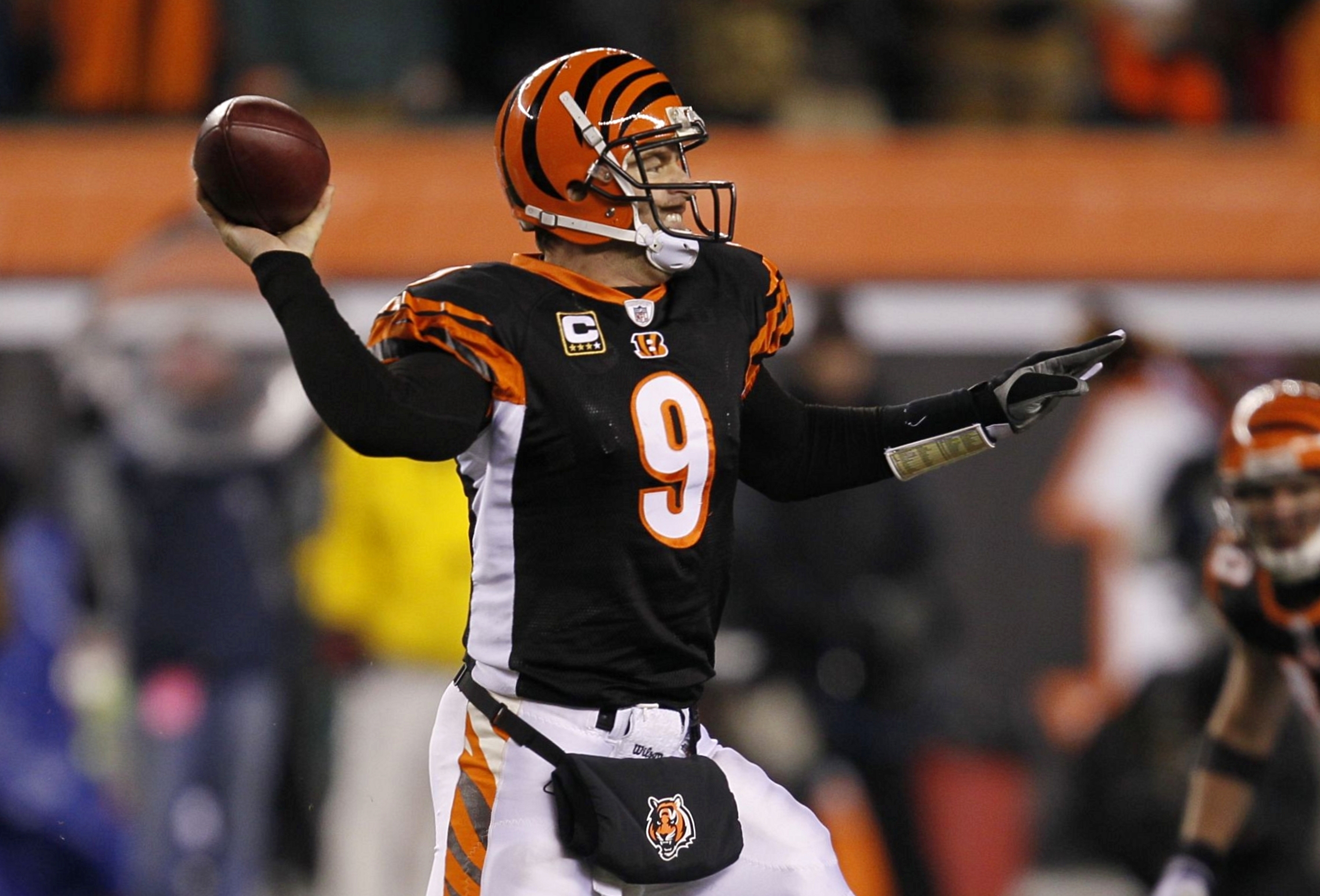 CINCINNATI - JANUARY 9:  Quarterback Carson Palmer #9 of the Cincinnati Bengals passes the ball in the fourth quarter against the New York Jets during the 2010 AFC wild-card playoff game at Paul Brown Stadium on January 9, 2010 in Cincinnati, Ohio. (Photo
