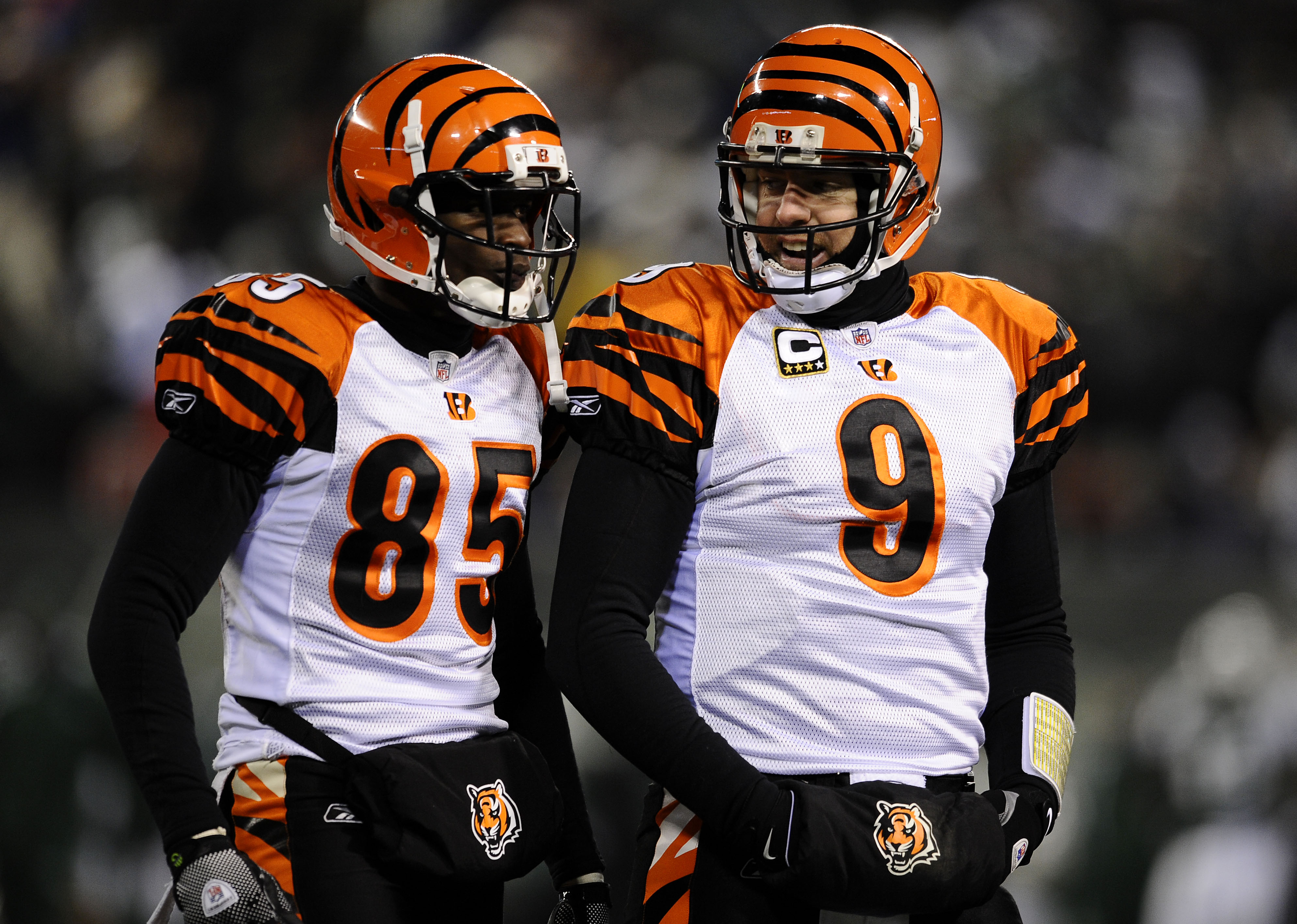 EAST RUTHERFORD, NJ - JANUARY 03:  Quarterback Carson Palmer #9 of the Cincinnati Bengals talks with teammate Chad Ochocinco #85 during the game against the New York Jets at Giants Stadium on January 3, 2010 in East Rutherford, New Jersey.  (Photo by Jeff