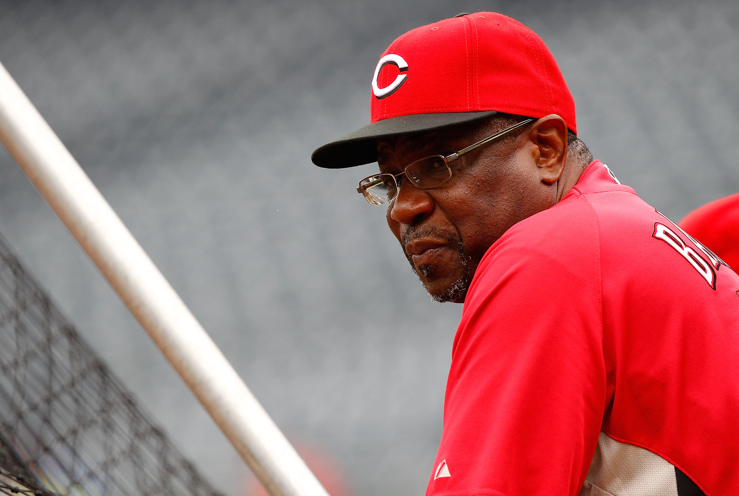 PITTSBURGH - AUGUST 03:  Manager Dusty Baker #12 of the Cincinnati Reds watches batting practice prior to the game against the Pittsburgh Pirates on August 3, 2010 at PNC Park in Pittsburgh, Pennsylvania.  (Photo by Jared Wickerham/Getty Images)