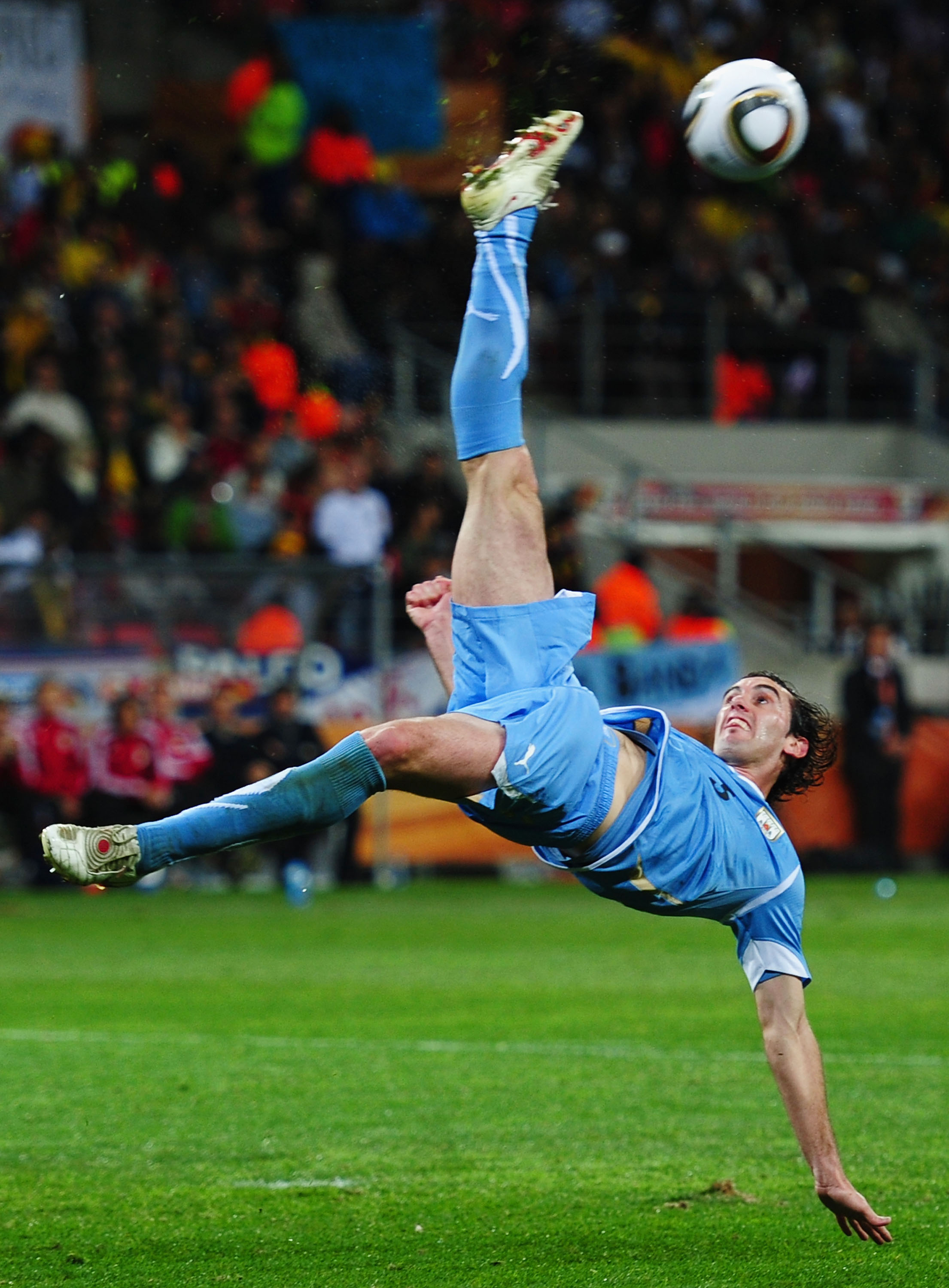 PORT ELIZABETH, SOUTH AFRICA - JULY 10: Diego Godin of Uruguay in action during the 2010 FIFA World Cup South Africa Third Place Play-off match between Uruguay and Germany at The Nelson Mandela Bay Stadium on July 10, 2010 in Port Elizabeth, South Africa.