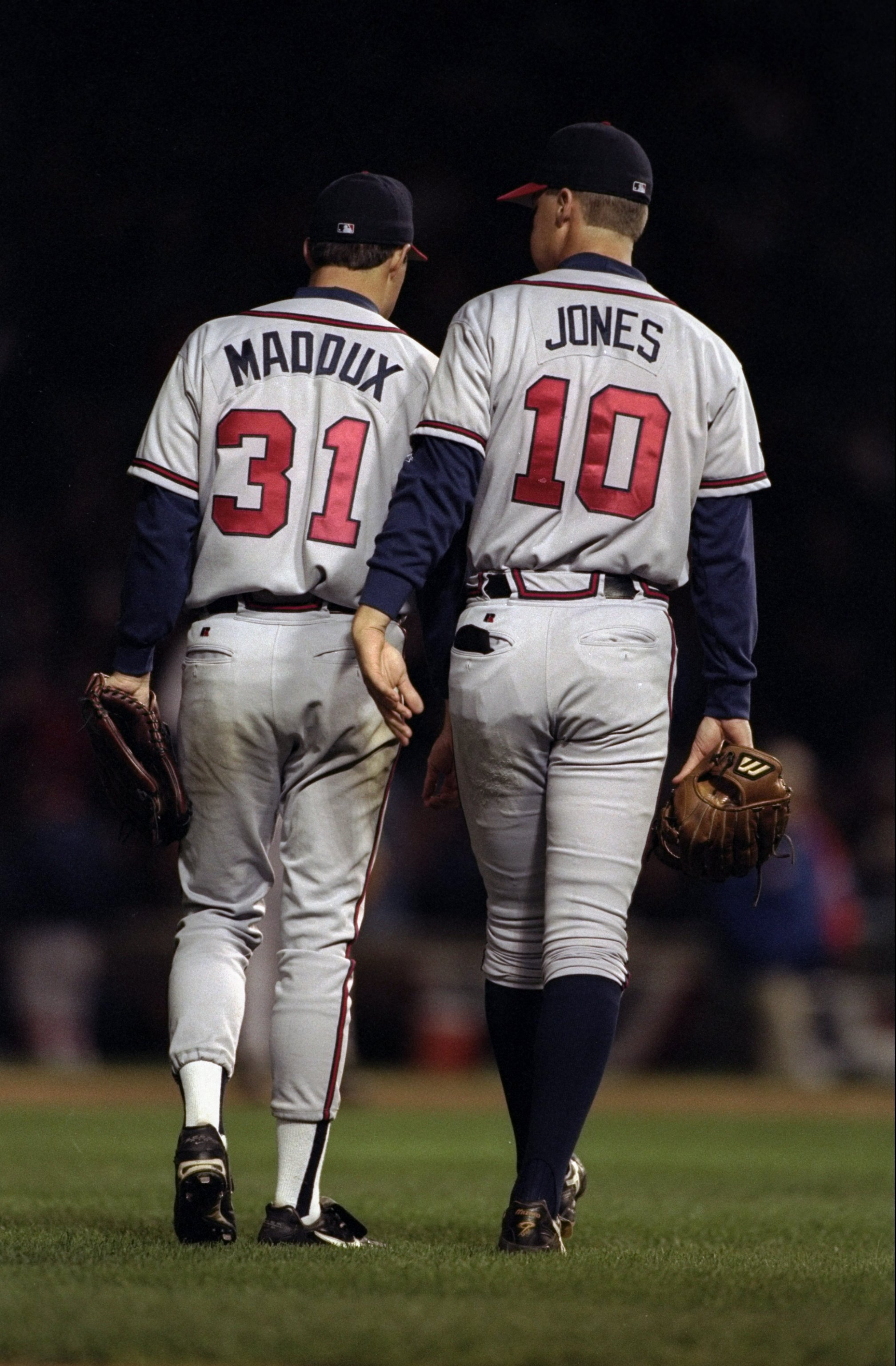 3 Oct 1998:  Pitcher Greg Maddux #31 and third baseman Chipper Jones #10 of the Atlanta Braves converse with one another during game three of the National League Divisional Series against the Chicago Cubs at Wrigley Field in Chicago, Illinois. The Braves 