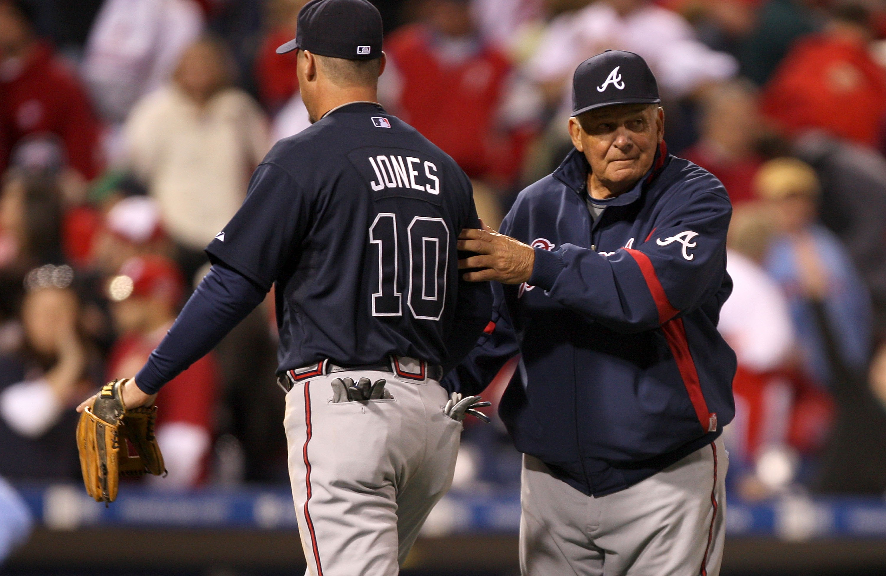 PHILADELPHIA - APRIL 05:  Chipper Jones #10 of the Atlanta Braves is congratulated by manager Bobby Cox after the Braves beat the Philadelphia Phillies on April 5, 2009 at Citizens Bank Park in Philadelphia, Pennsylvania. Today's game is the opening of th