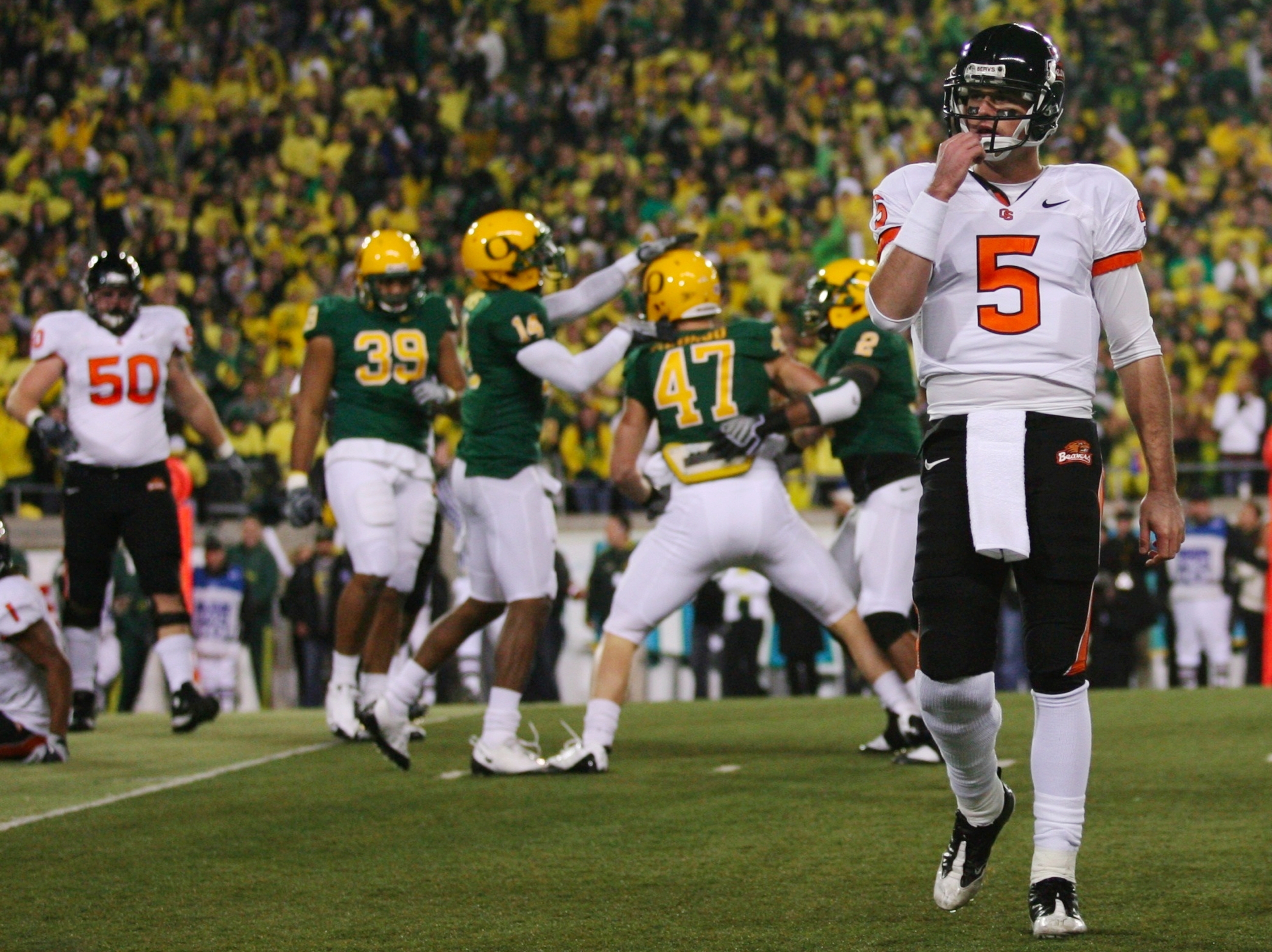 EUGENE,OR - DECEMBER 03: Quarterback Sean Canfield #47 of the Oregon State Beavers walks off the field after teammate Jacquizz Rodgers #1 is tackled by Kiko Alonso #47 of the Oregon Ducks during the second quarter of the game at Autzen Stadium on December