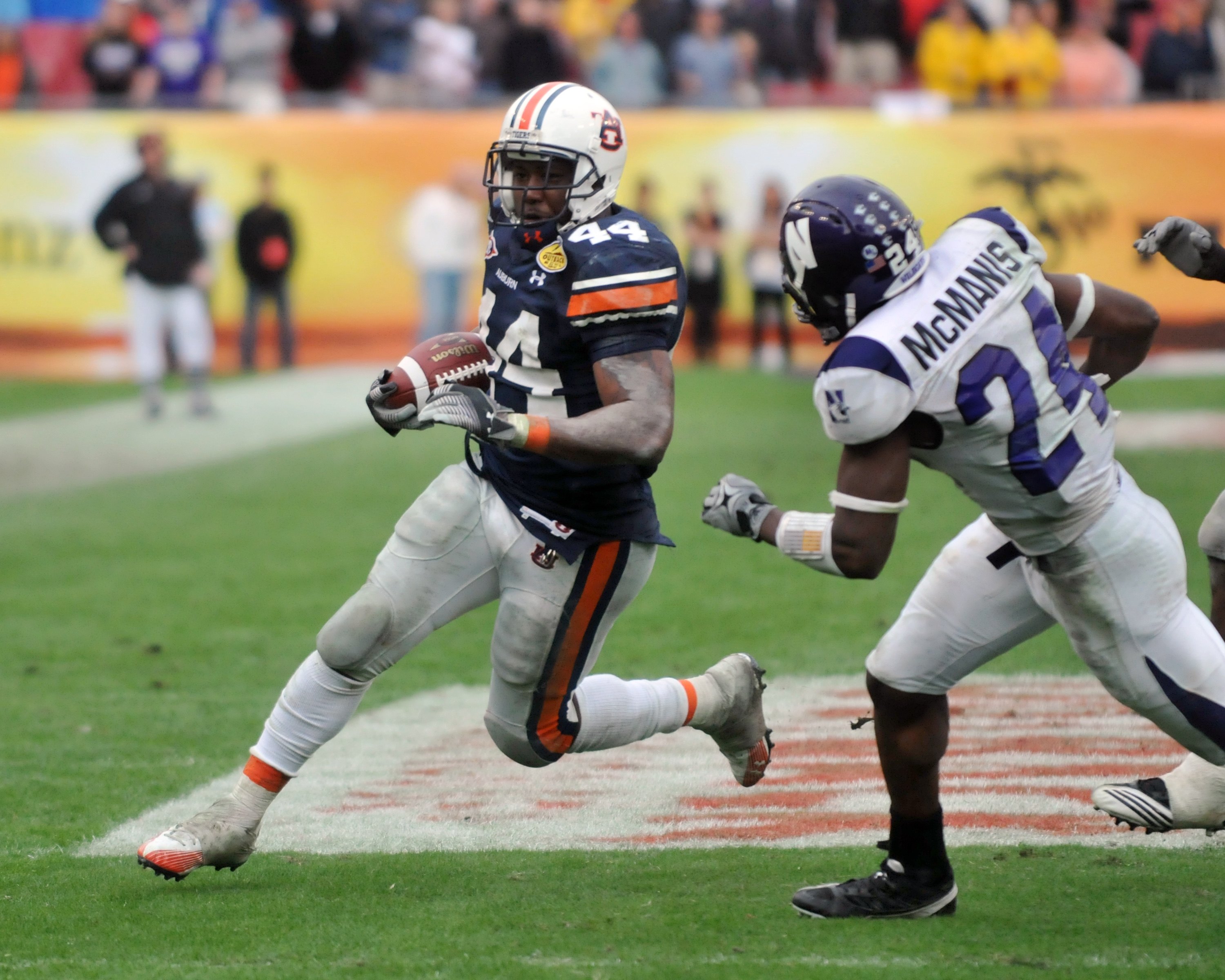 TAMPA, FL - JANUARY 1: Running back Ben Tate #44 of the Auburn Tigers rushes upfield against the Northwestern Wildcats in the Outback Bowl January 1, 2010 at Raymond James Stadium in Tampa, Florida. (Photo by Al Messerschmidt/Getty Images)