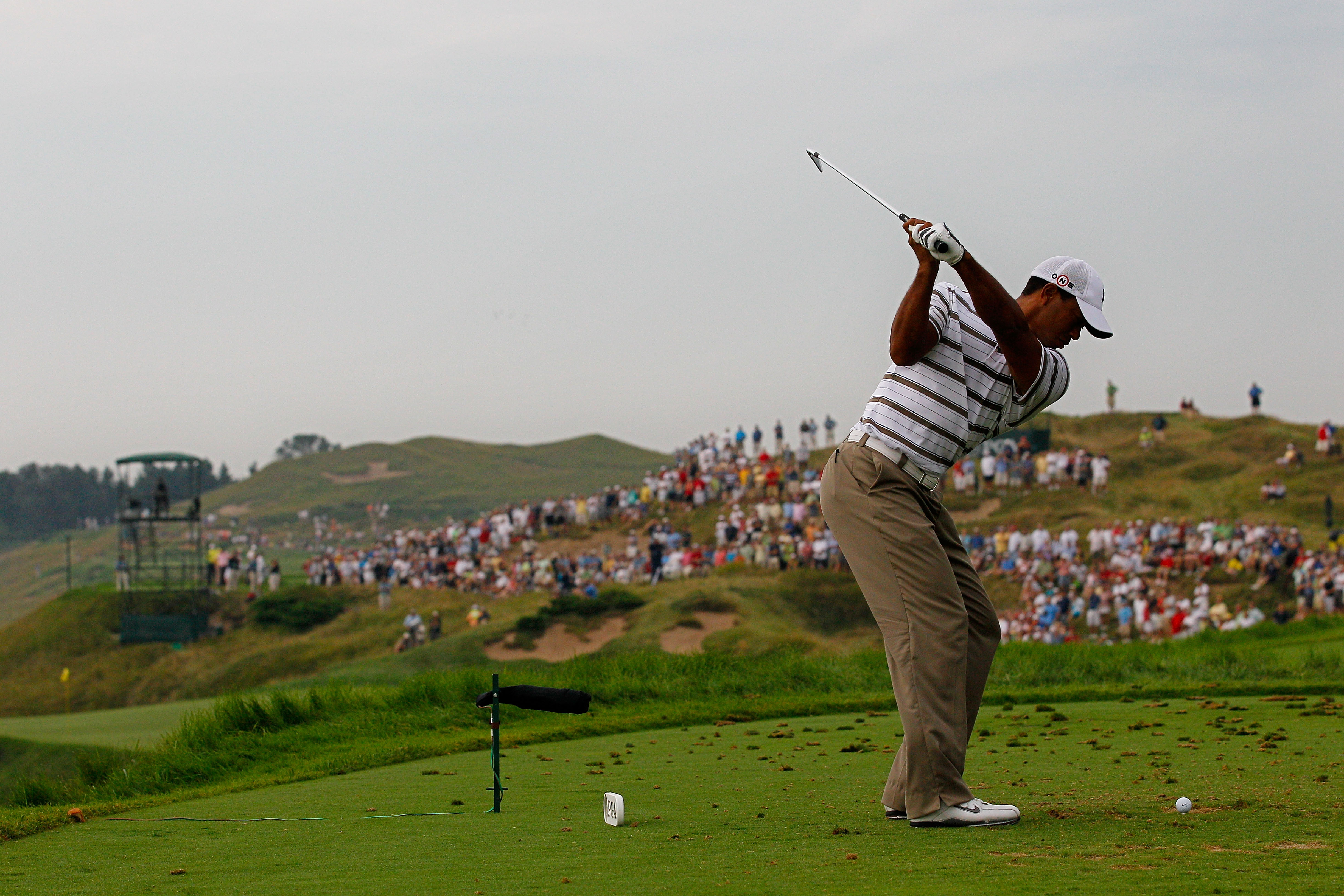 KOHLER, WI - AUGUST 13:  Tiger Woods hits his tee shot on the third hole during the second round of the 92nd PGA Championship on the Straits Course at Whistling Straits on August 13, 2010 in Kohler, Wisconsin.  (Photo by Sam Greenwood/Getty Images)