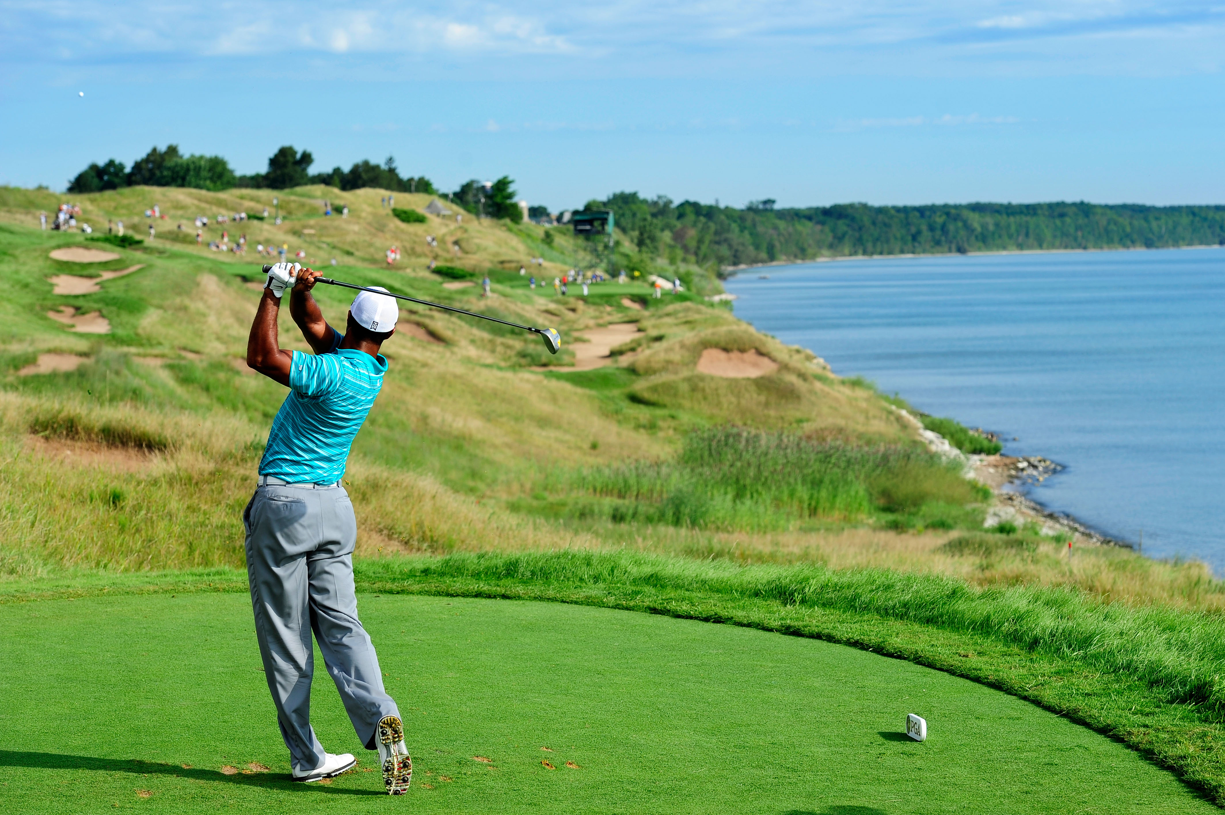 KOHLER, WI - AUGUST 14:  Tiger Woods hits his tee shot on the 13th hole during the continuation of the second round of the 92nd PGA Championship on the Straits Course at Whistling Straits on August 14, 2010 in Kohler, Wisconsin.  (Photo by Stuart Franklin