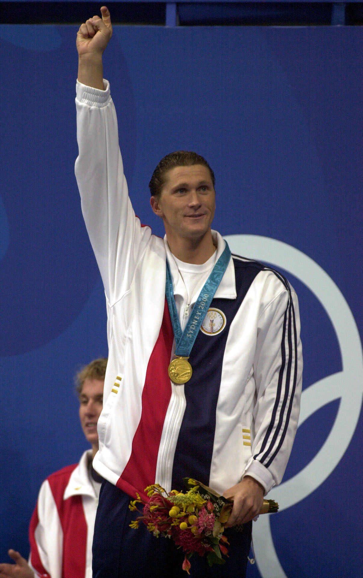 21 Sep 2000:  Lenny Krayzelburg of the USA celebrates with his gold medal after victory in the Mens 200m Backstroke Final during the Sydney 2000 Olympic Games at the Aquatic Centre, Olympic Park, Sydney, Australia. DIGITAL IMAGE. Mandatory Credit: Ross Ki