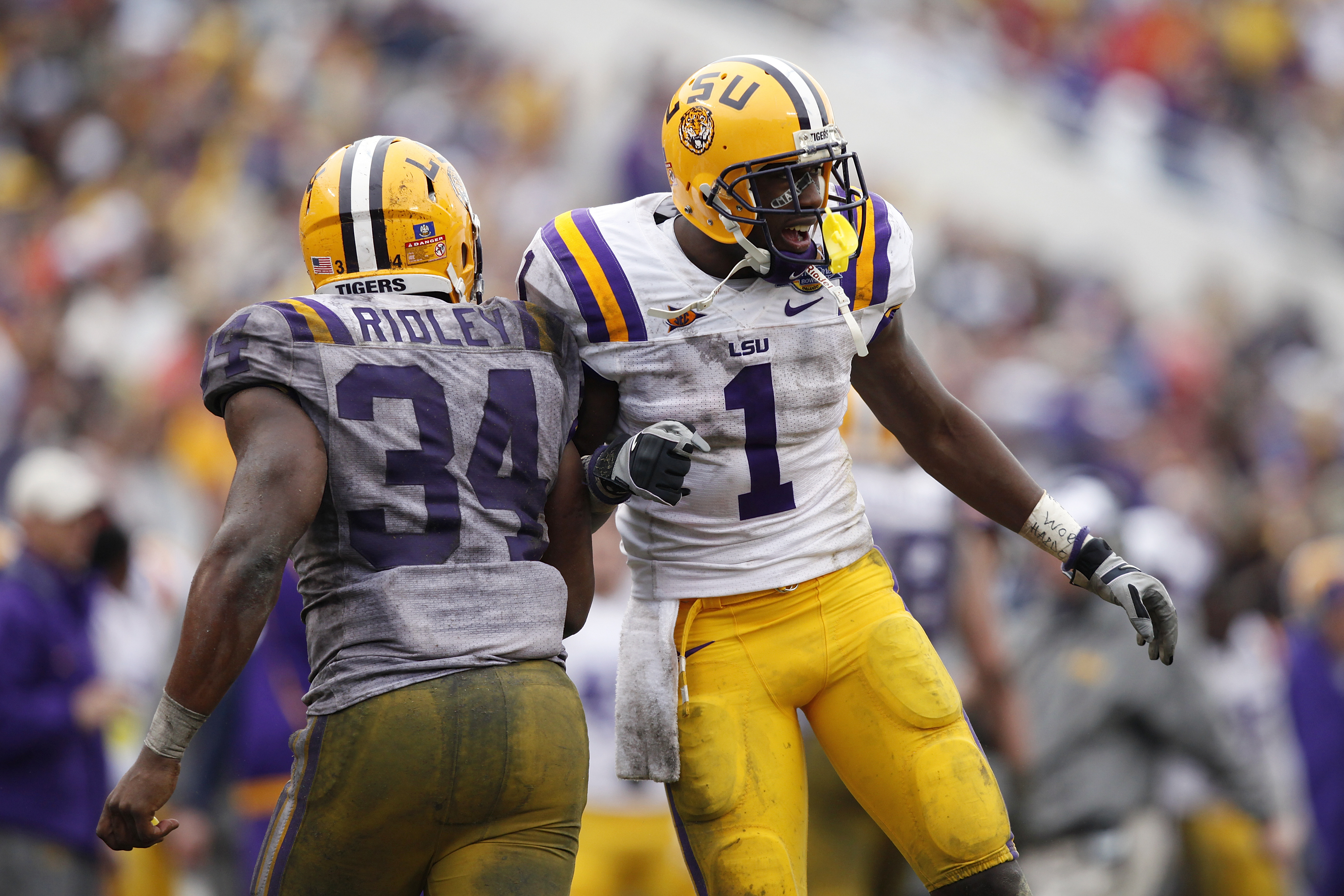 ORLANDO, FL - JANUARY 1: Brandon LaFell #1 and Stevan Ridley #34 of the LSU Tigers celebrate after Ridley scored a touchdown in the fourth quarter against the Penn State Nittany Lions during the 2010 Capital One Bowl at the Florida Citrus Bowl Stadium on