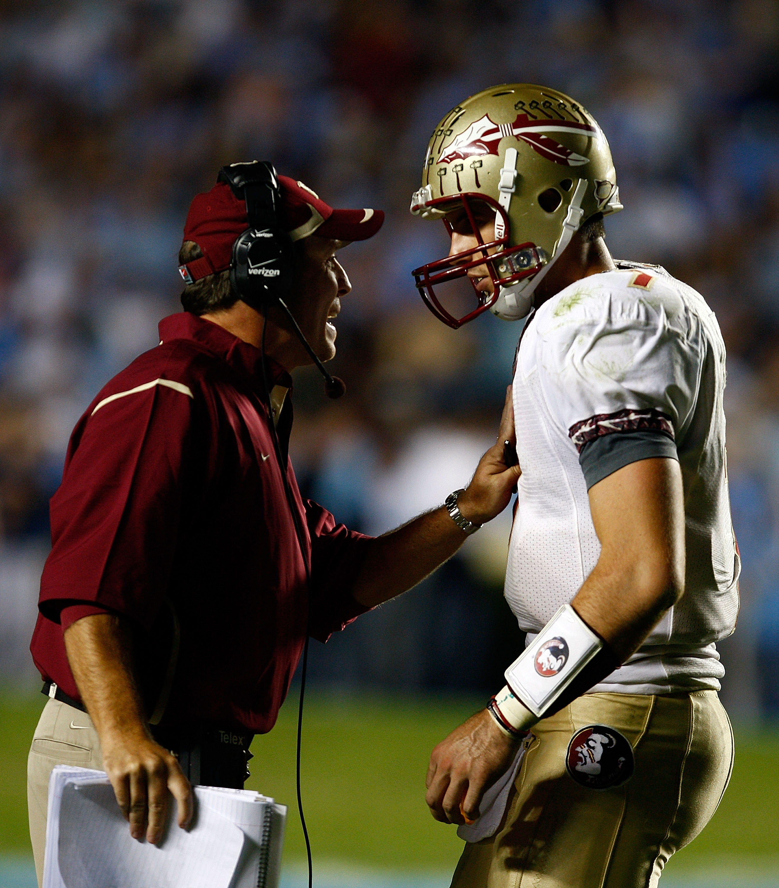CHAPEL HILL, NC - OCTOBER 22: Florida State Seminoles Offensive Coordinator Jimbo Fisher speaks with his quarterback Christian Ponder #7 during their game against the North Carolina Tar Heels at Kenan Stadium on October 22, 2009 in Chapel Hill, North Car