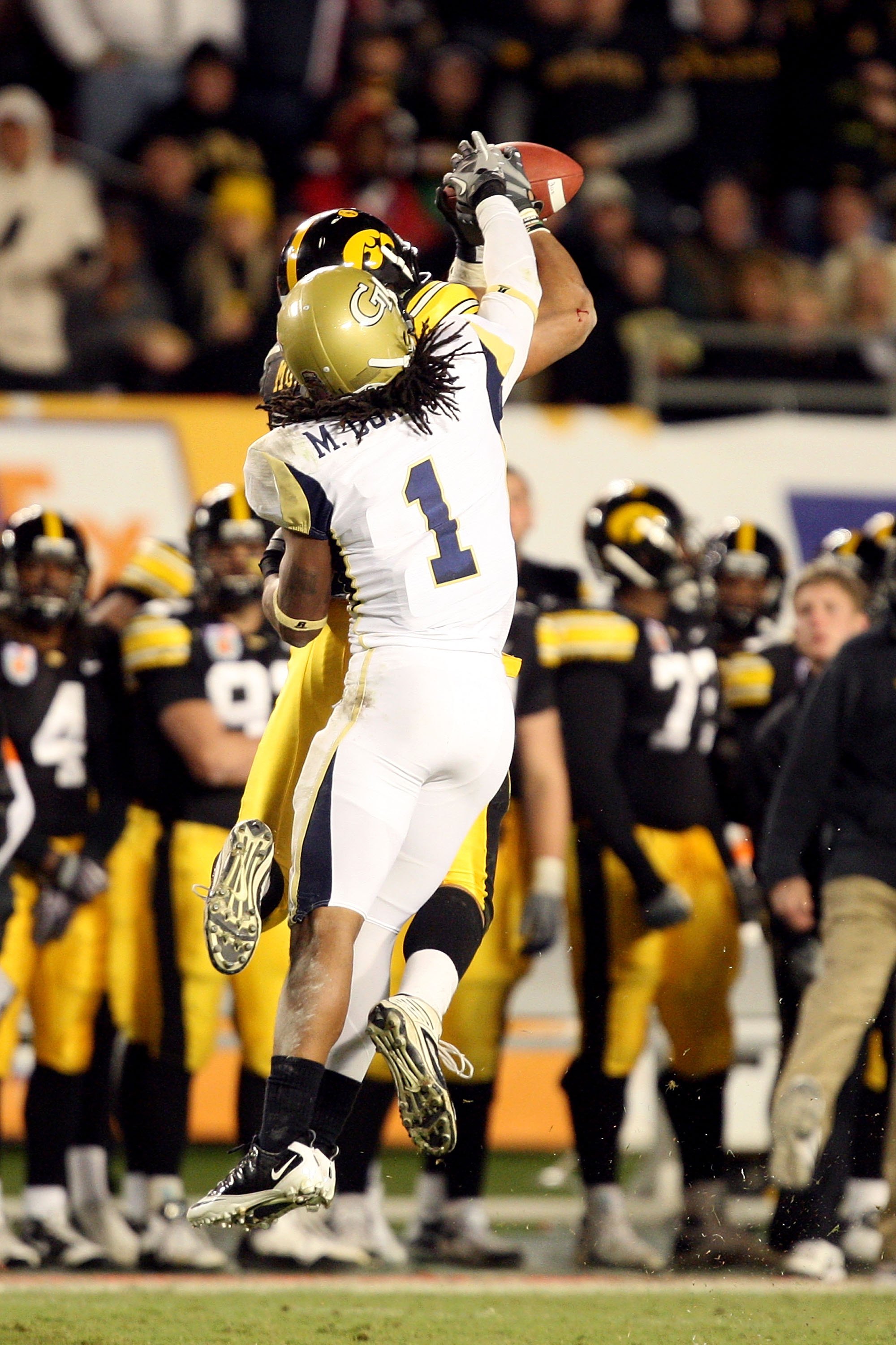 MIAMI GARDENS, FL - JANUARY 05: Morgan Burnett #1 of the Georgia Tech Yellow Jackets defends against the Iowa Hawkeyes during the FedEx Orange Bowl at Land Shark Stadium on January 5, 2010 in Miami Gardens, Florida. (Photo by Streeter Lecka/Getty Images