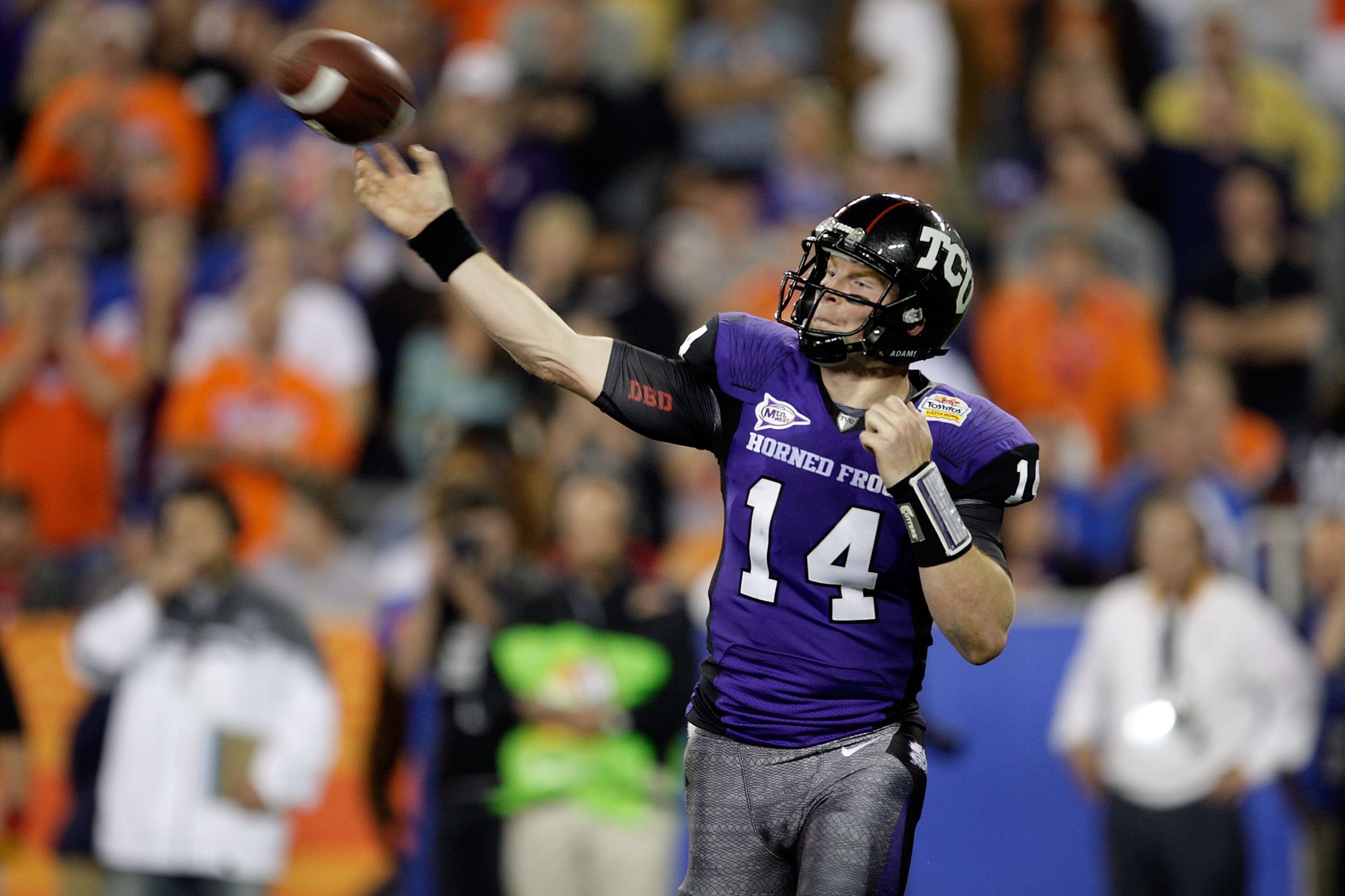 GLENDALE, AZ - JANUARY 04: Quarterback Andy Dalton #14 of the TCU Horned Frogs passes the ball against the Boise State Broncos during the Tostitos Fiesta Bowl at the Universtity of Phoenix Stadium on January 4, 2010 in Glendale, Arizona. (Photo by Jamie