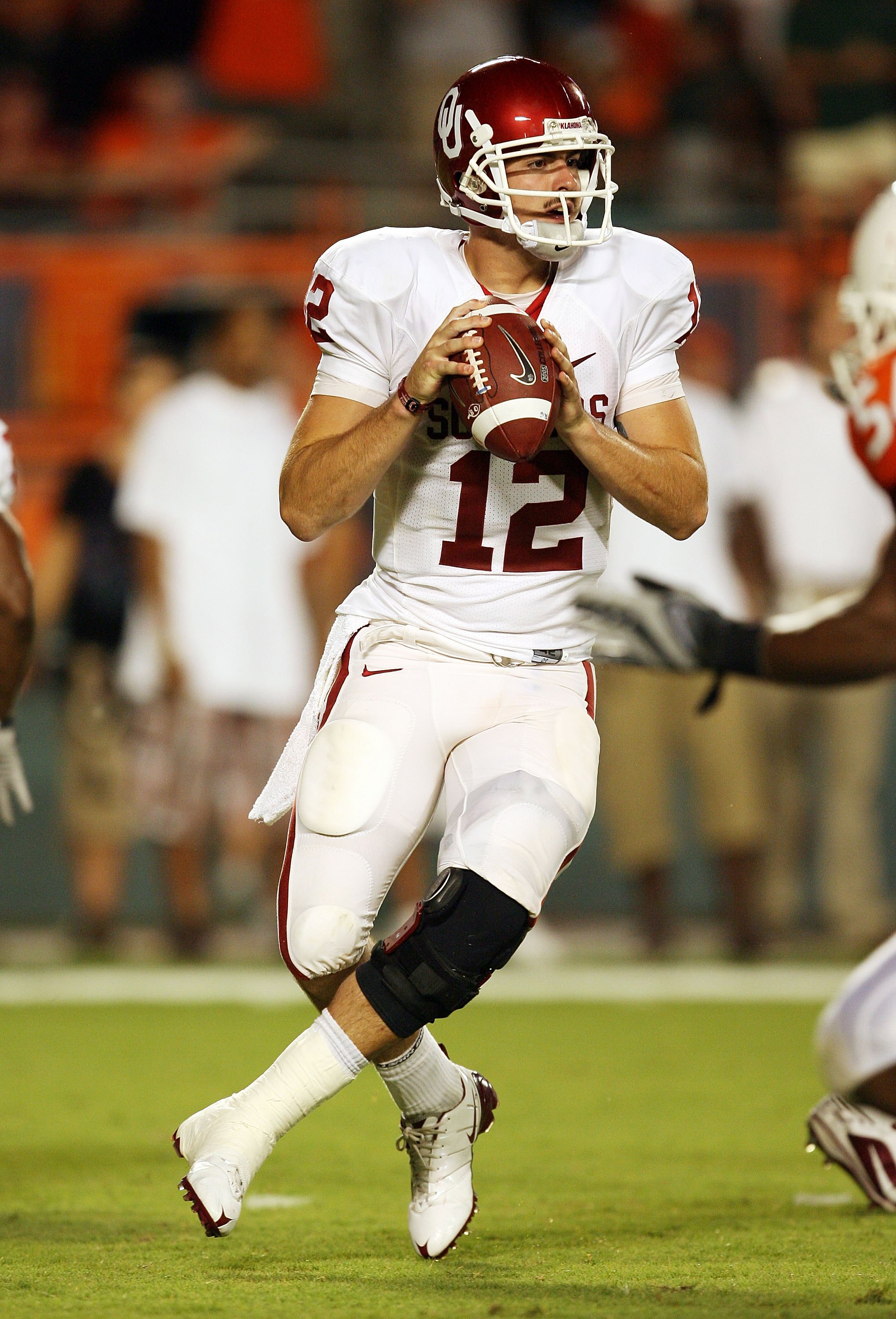 MIAMI GARDENS, FL - OCTOBER 03: Quarterback Landry Jones #12 of the Oklahoma Sooners drops back to pass against the Miami Hurricanes at Land Shark Stadium on October 3, 2009 in Miami Gardens, Florida. Miami defeated Oklahoma 21-20. (Photo by Doug Benc/G