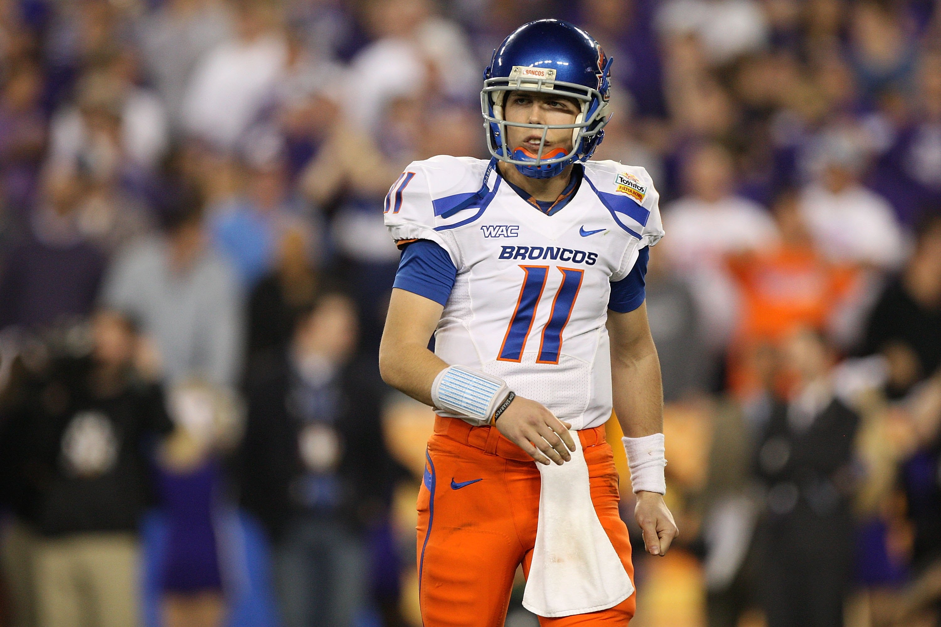 GLENDALE, AZ - JANUARY 04: Quarterback Kellen Moore #11 of the Boise State Broncos looks over to his sideline in the second half against the TCU Horned Frogs during the Tostitos Fiesta Bowl at the Universtity of Phoenix Stadium on January 4, 2010 in Glen
