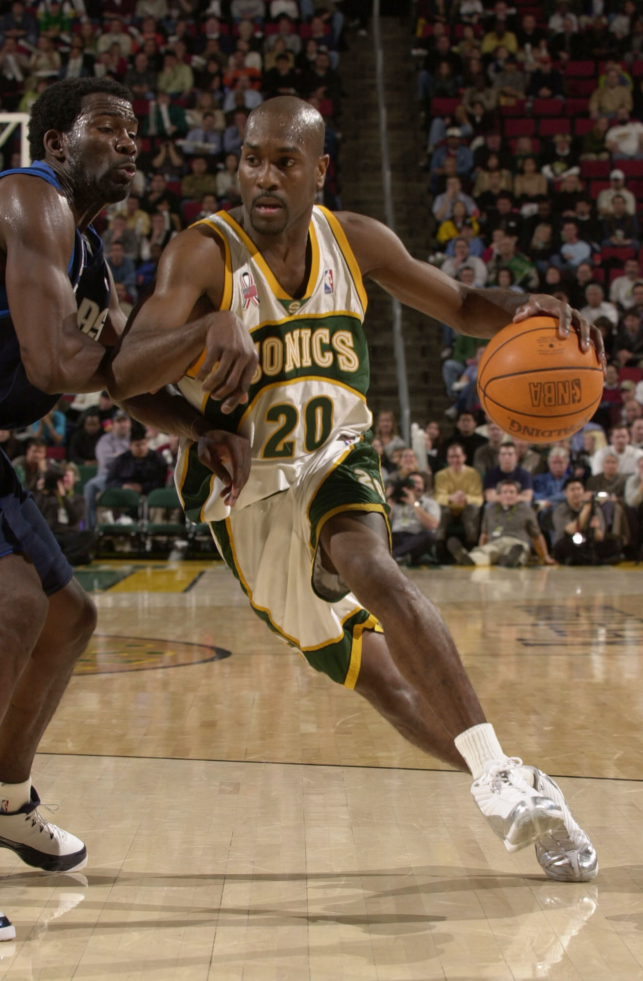 12 Feb 2002:  Gary Payton #20 of the Seattle Supersonics drives against Michael Finley #4 of the Dallas Mavericks at Key Arena in Seattle, Washington. The Mavericks defeated the Sonics 112-106. Digital Image. NOTE TO USER:  User expressly acknowledges and