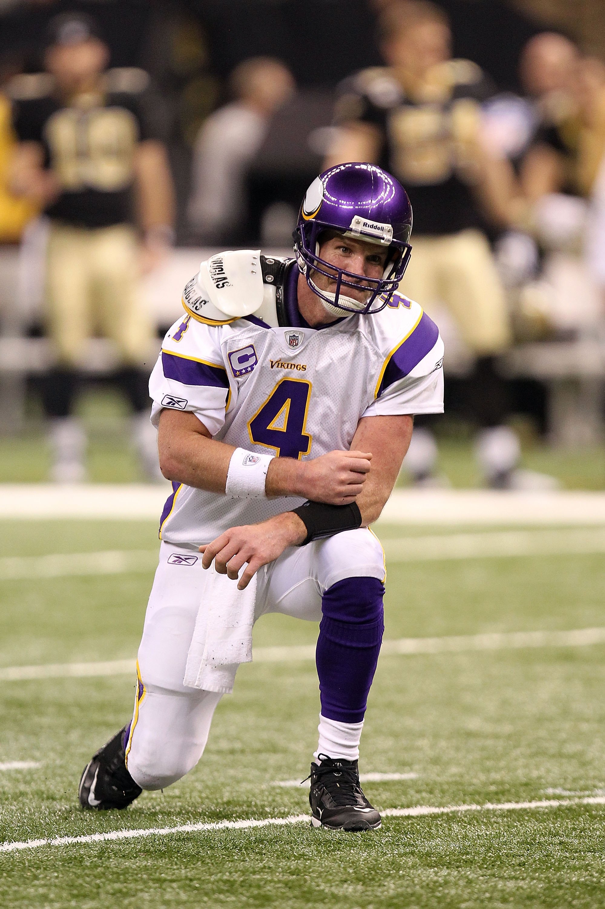 January 17 2010: Minnesota Vikings quarterback Brett Favre (4) raises his  helmet during The National Anthem. The Minnesota Vikings defeated the  Dallas Cowboys by a score of 34 to 3 at Mall