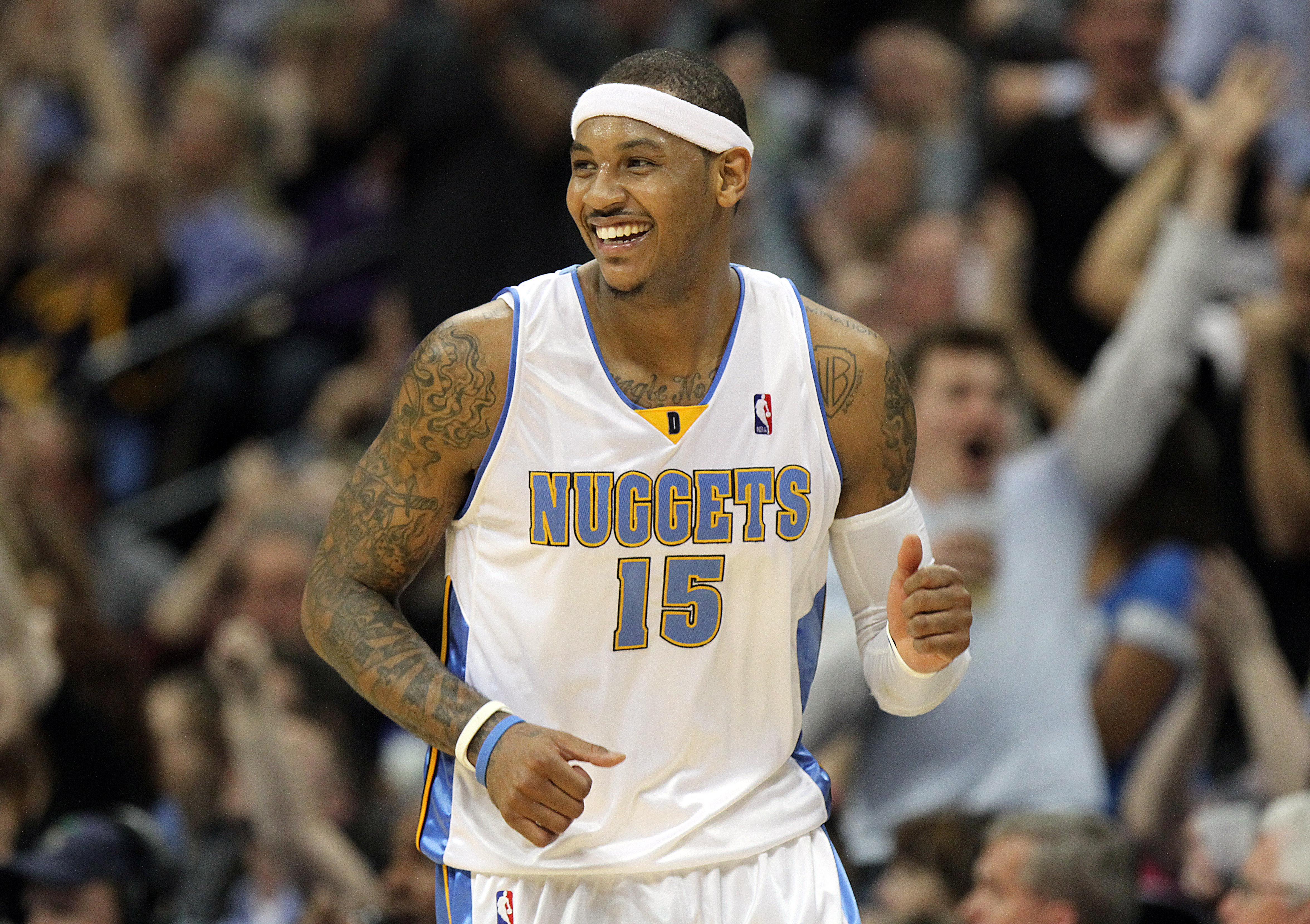 Denver Nuggets forward Carmelo Anthony (C) dunks against Dallas