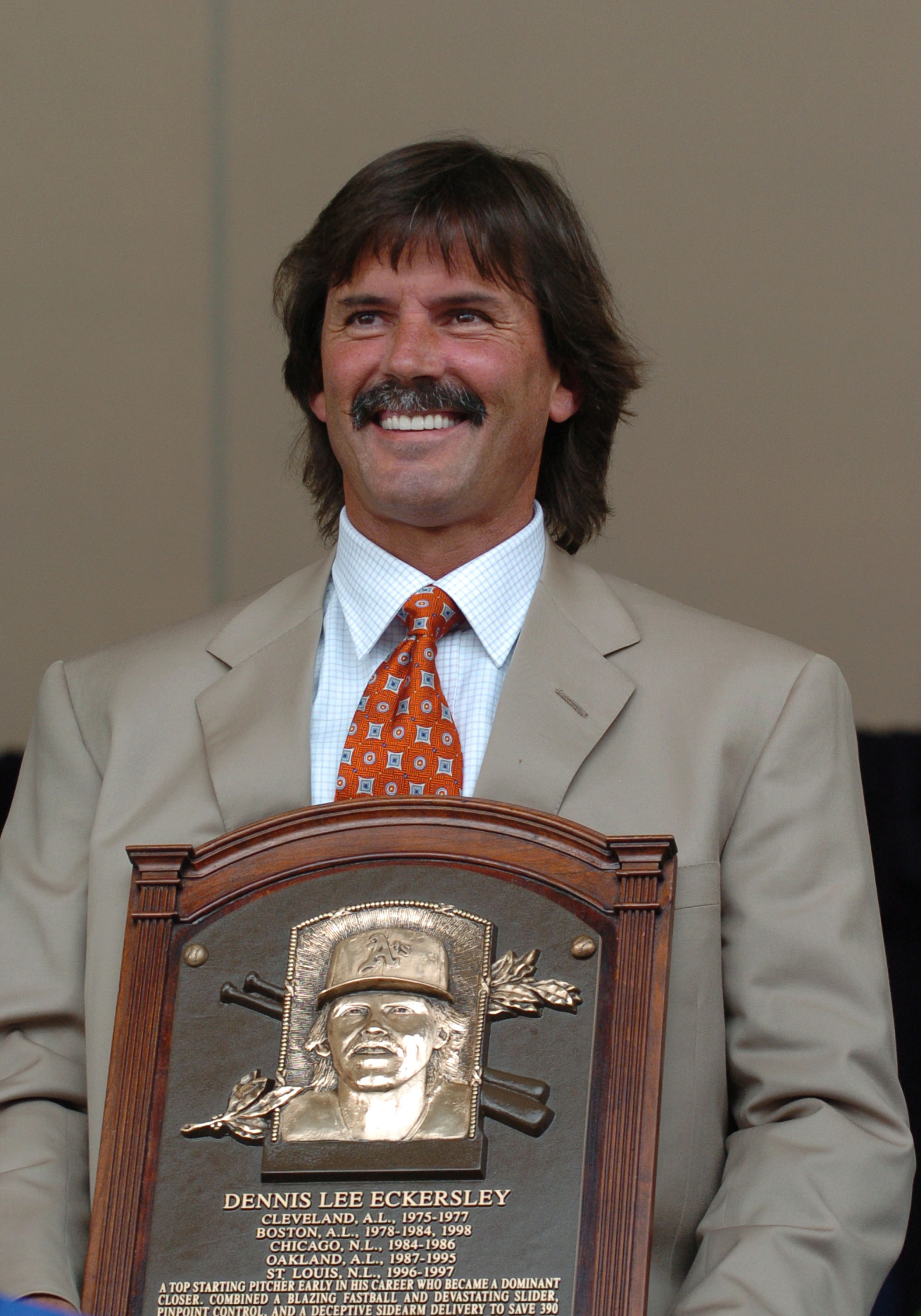 Dennis Eckersley poses with his Hall of Fame plaque.